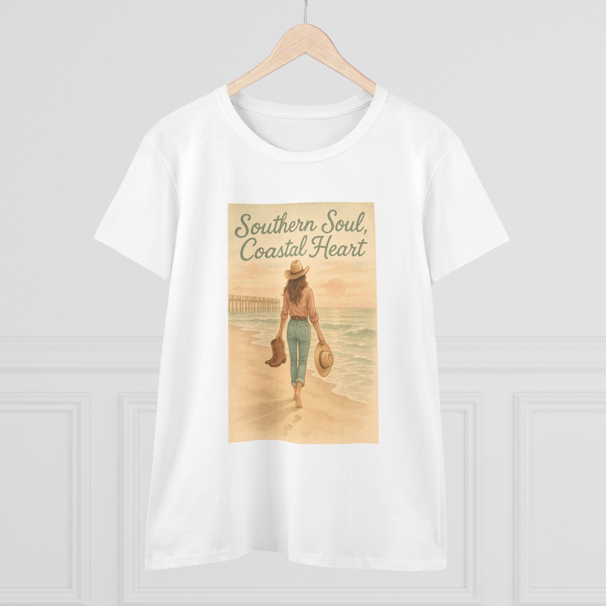 Southern Soul Coated Heart Tee in white displayed on a wooden hanger, featuring a serene beach image for a relaxed summer vibe.