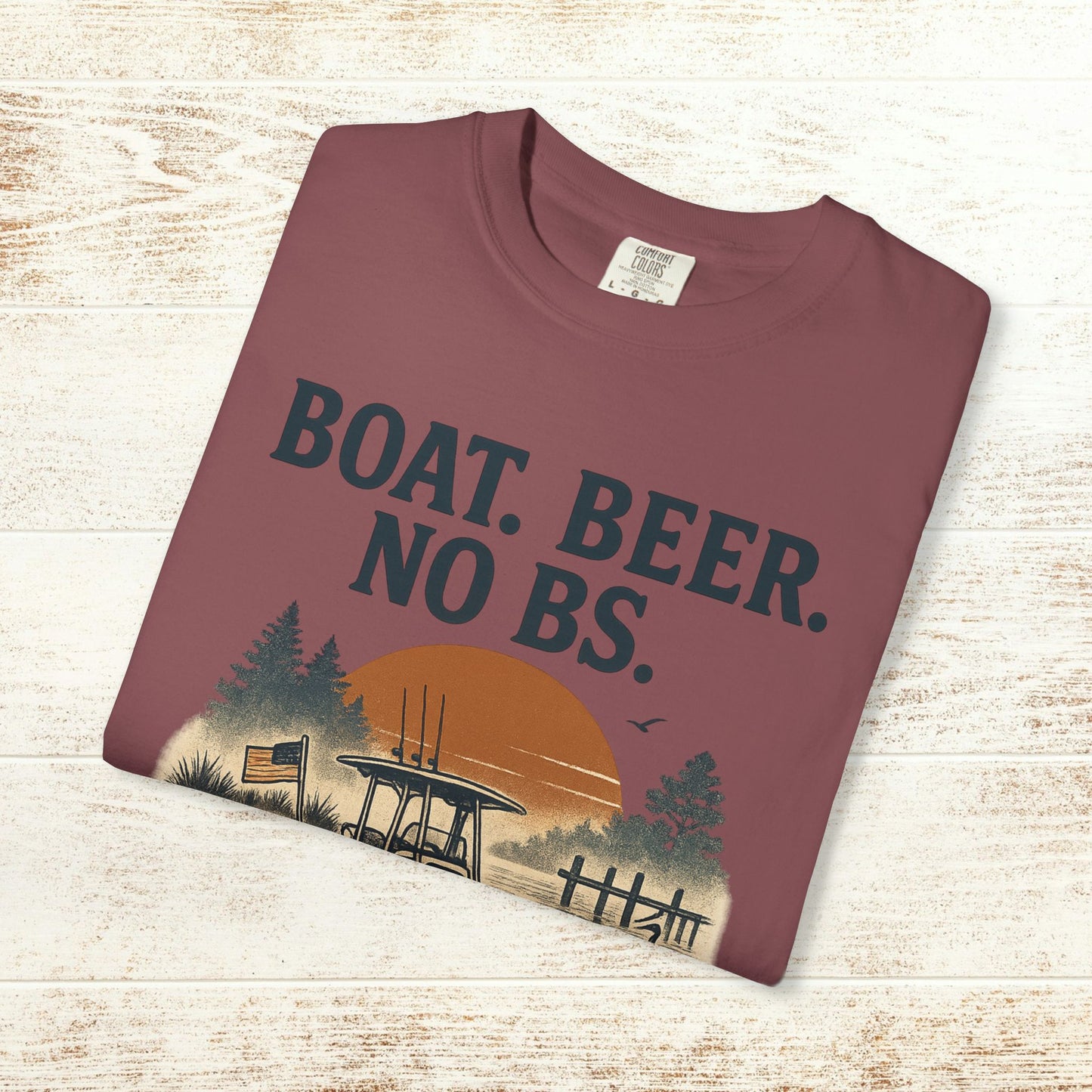 Boat Beer No BS Tee displayed flat, featuring a scenic graphic design with a sunset and forest backdrop.