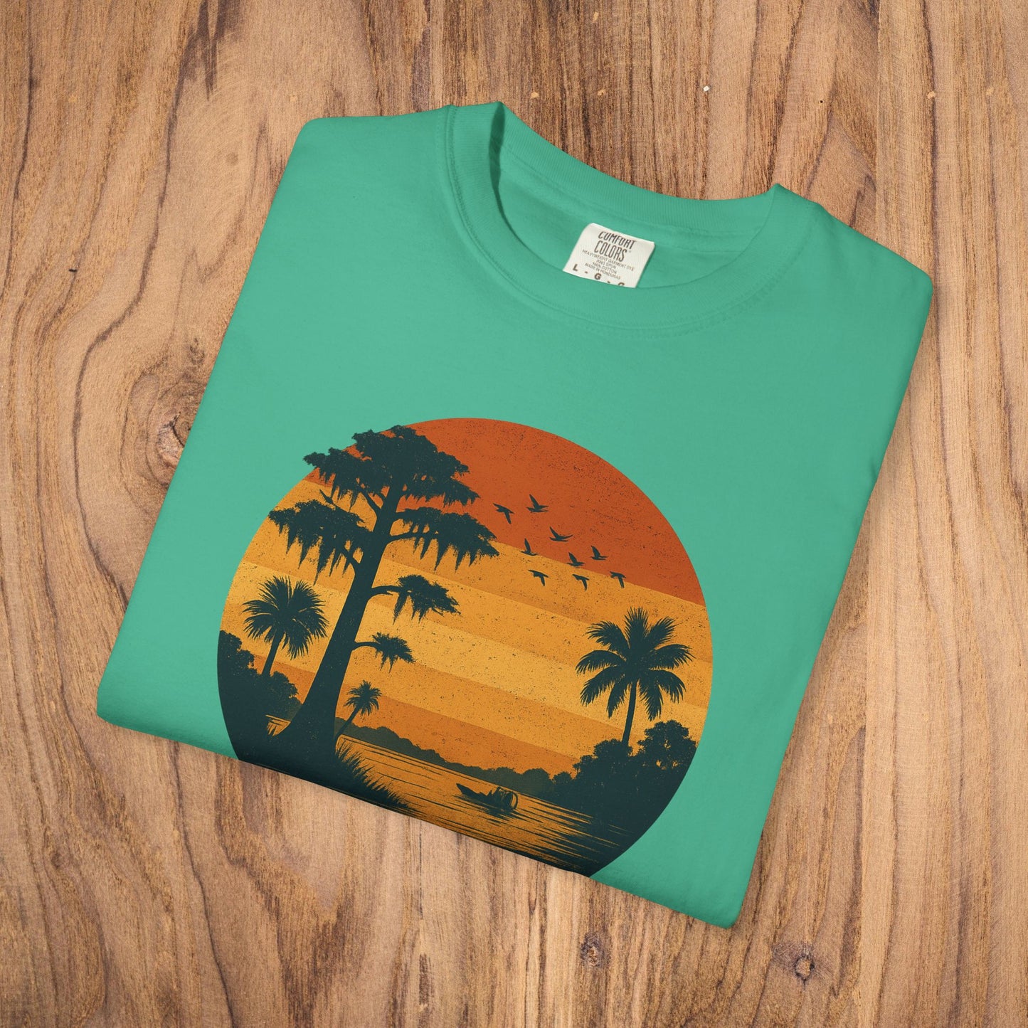 Unisex Garment-Dyed Sunset Tee featuring a beautiful sunset and palm trees illustration, offered in sizes S to 4XL, a stylish choice for any casual event.