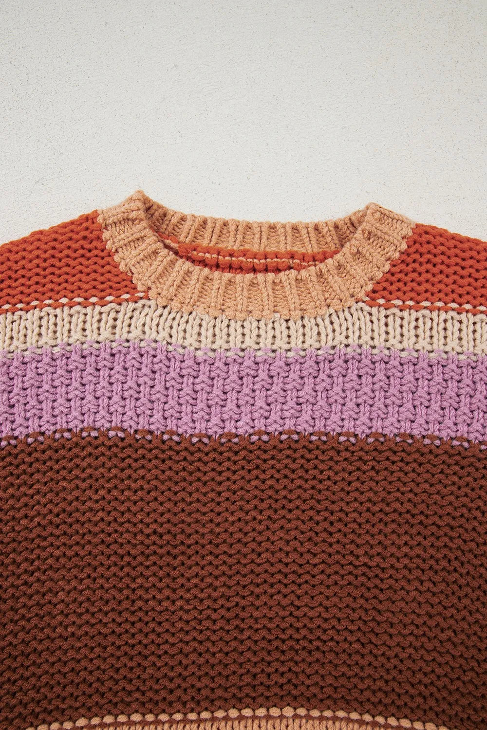 Stylish Colorblock Striped Sweater with Round Neck - Close-up of the knitted round neck of the sweater, emphasizing the quality and craftsmanship of the acrylic material.