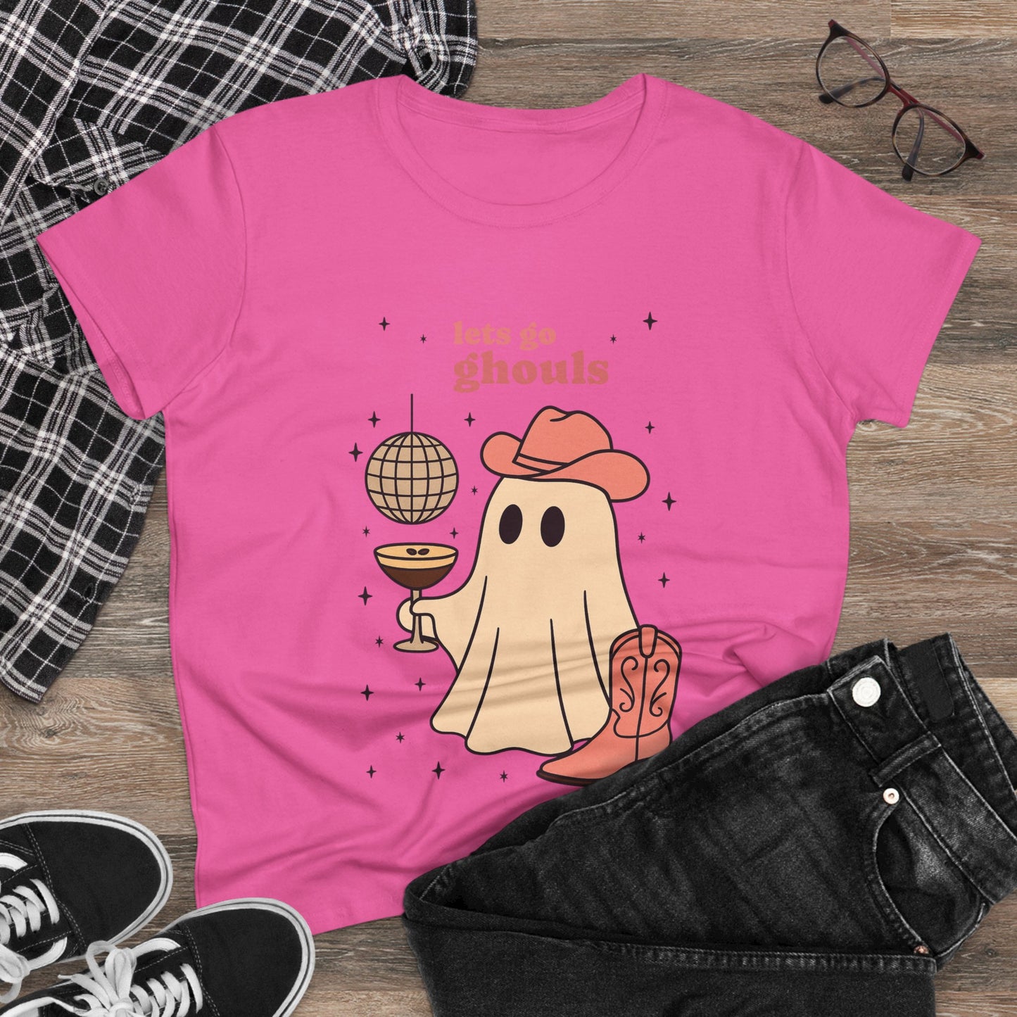 Let's Go Ghouls Tee in pink featuring a cute ghost design with a drink and disco ball, perfect for Halloween celebrations.