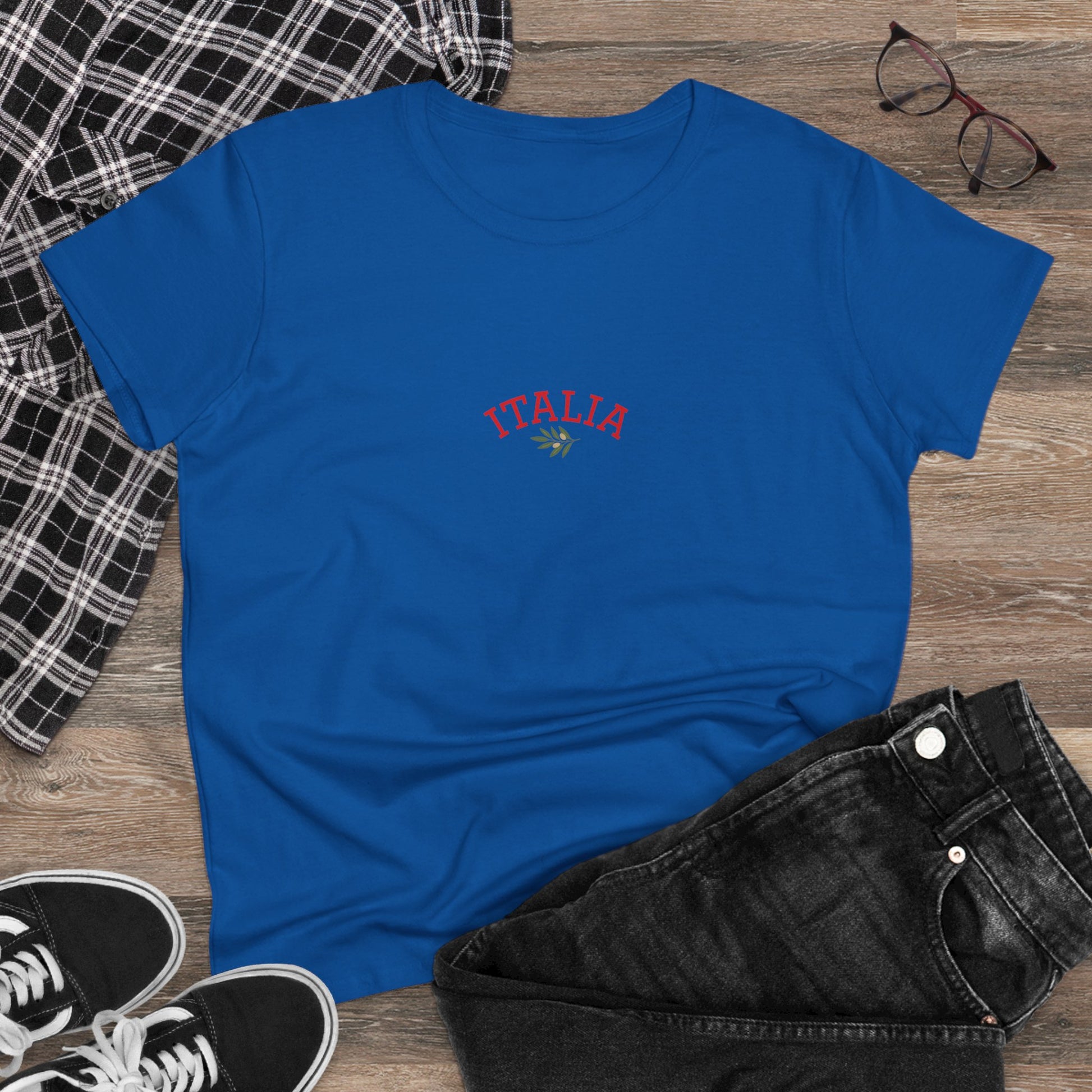 Flat lay of the Unisex Ultra Cotton Tee with Italian Heritage Design showing 'ITALIA' embroidered in red on a blue shirt, styled with denim and sneakers for casual adventures.