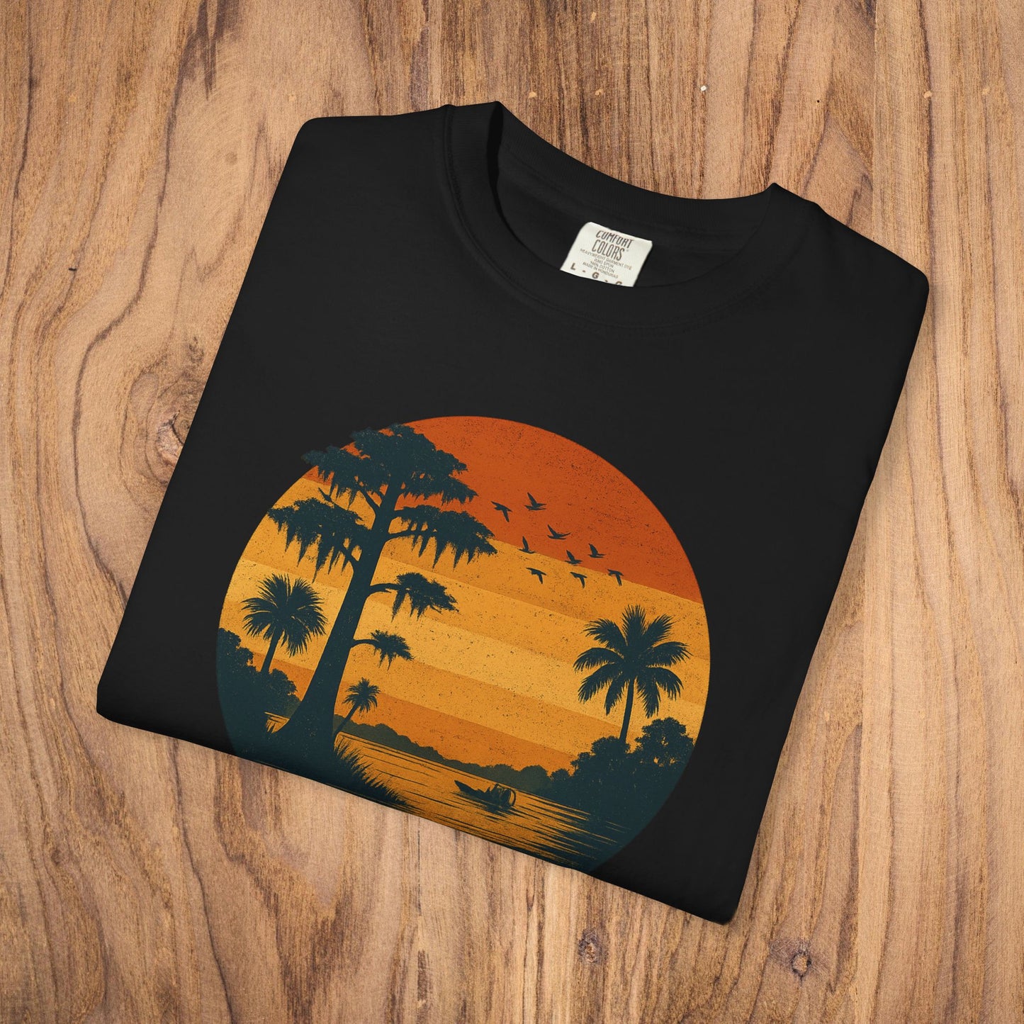 Unisex Garment-Dyed Sunset Tee - Soft 100% Cotton T-Shirt in black, featuring a striking sunset illustration with palm trees, suitable for comfortable casual style.