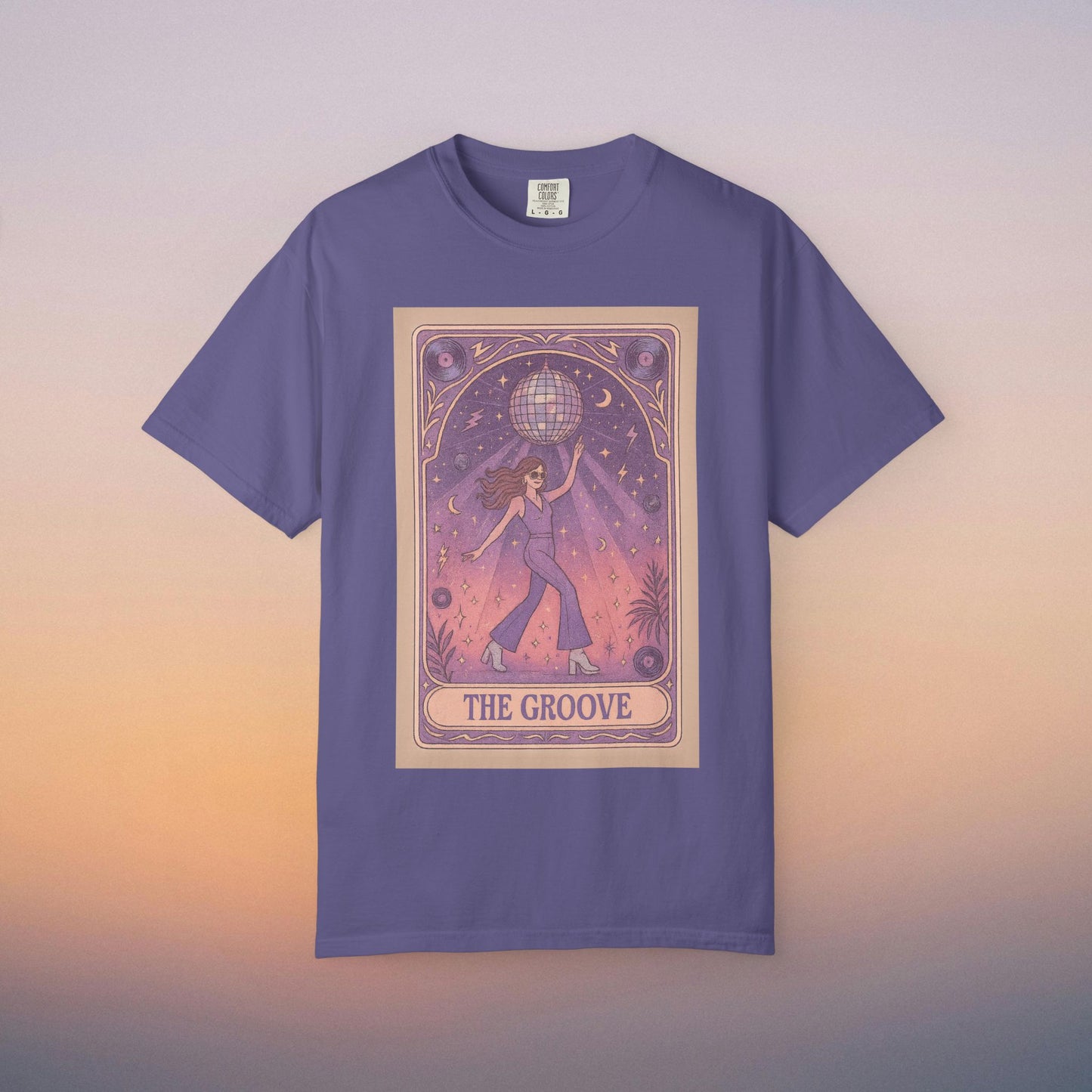 Groove Tarot Graphic Tee in purple, featuring a whimsical design of a figure holding a disco ball, perfect for tarot enthusiasts and stylish casual wear.