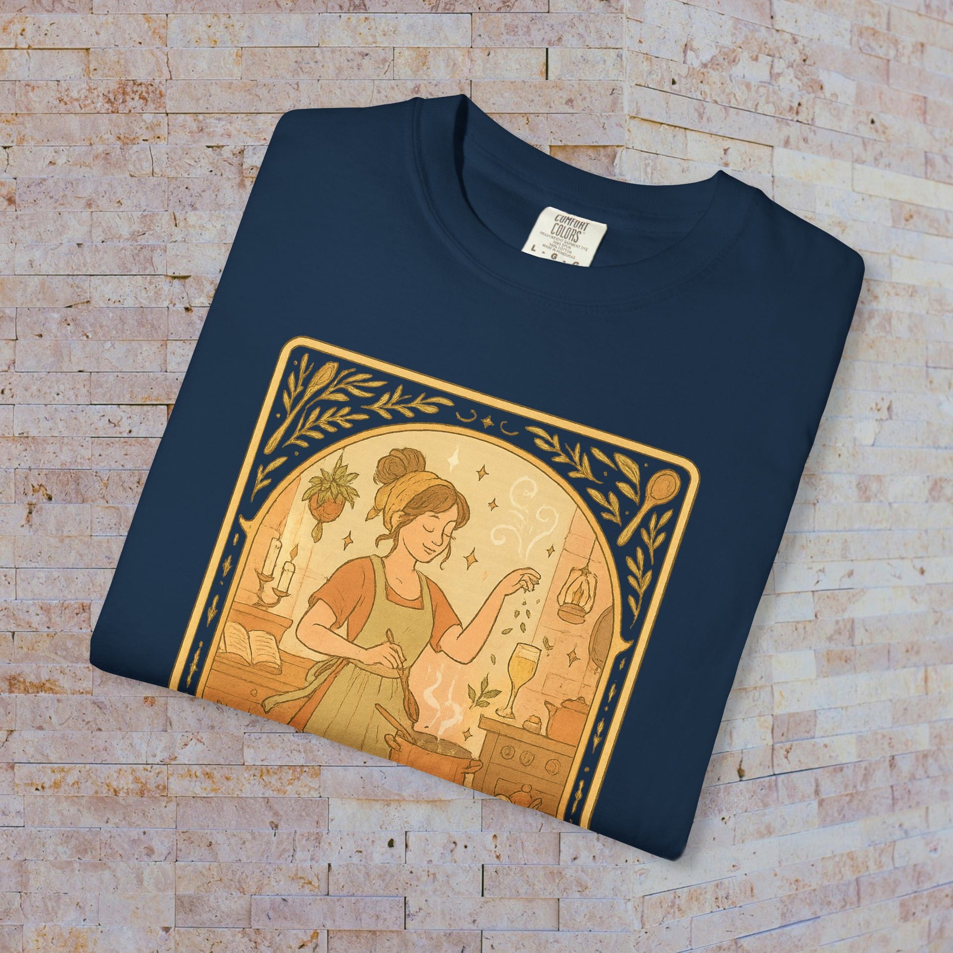 Culinary Queen Tarot Tee in navy blue, featuring a charming illustration of a woman cooking, ideal for those who love culinary arts. Offered in sizes S to 4XL, crafted from soft pre-shrunk cotton fabric.