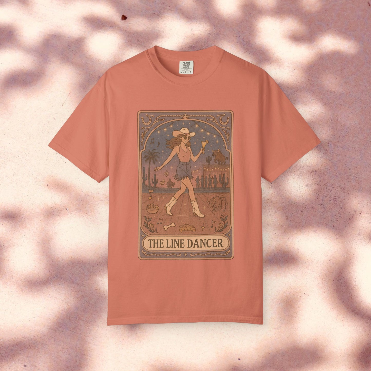 Line Dancer Tarot Tee in soft pink, designed with a whimsical dancer graphic, made ethically and from high-quality cotton, available in sizes S-4XL.