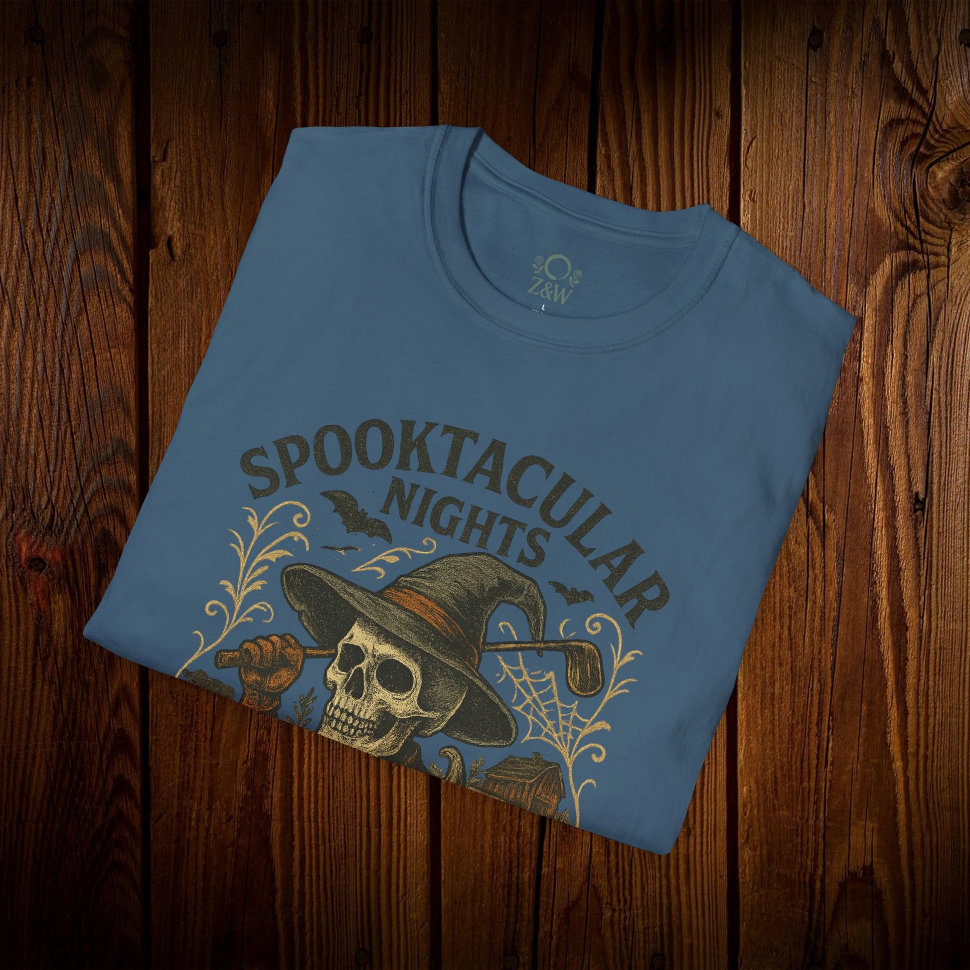 Spooktacular Nights Halloween T-Shirt for Unisex displayed flat, showcasing a stylish graphic design ideal for festive autumn events.