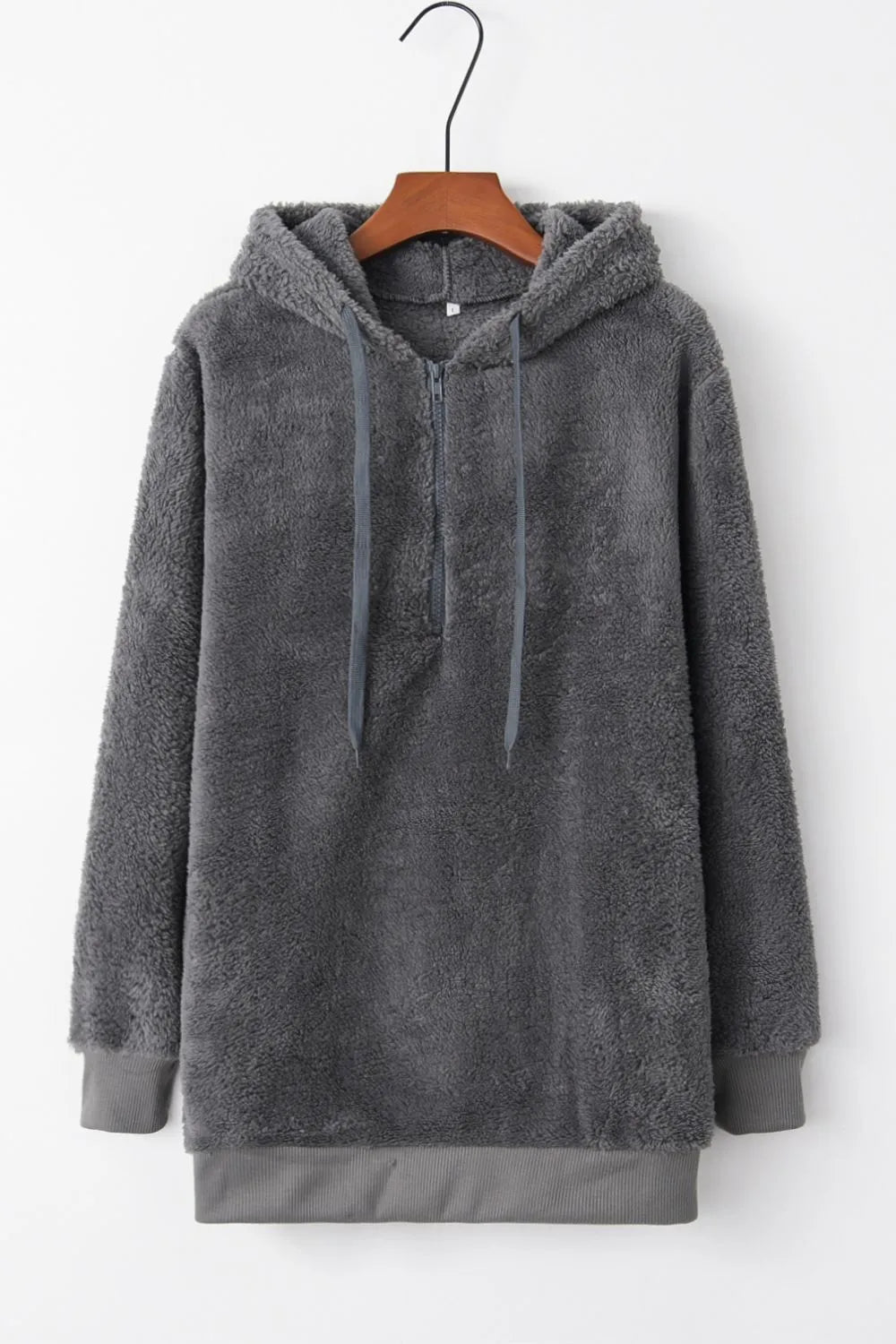 Cozy Full Size Teddy Hoodie with Quarter-Zip and Drawstring, Opaque & Slightly Stretchy, 100% Polyester, displayed on a hanger in a stylish setting.
