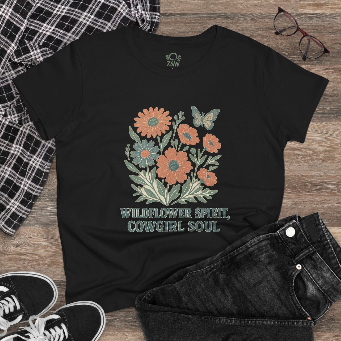 Wildflower Spirit Cotton Tee in classic black, showcasing a beautiful floral graphic with 'Wildflower Spirit, Cowgirl Soul' text, ideal for any wardrobe.