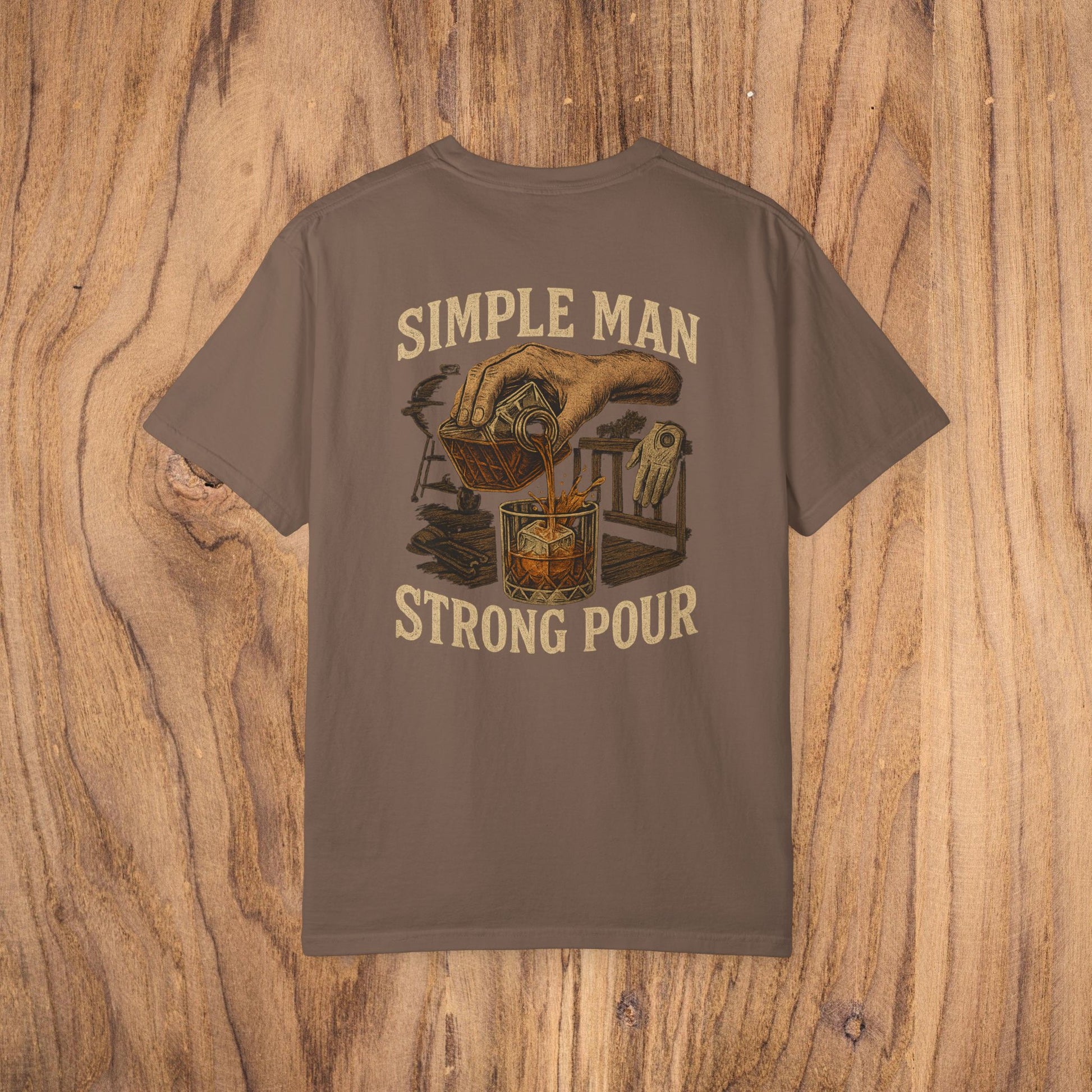Simple Man Strong Pour T-Shirt in earthy brown featuring a vintage hand-drawn design pouring a drink, highlighting ethical sourcing and classic fit with 100% cotton for maximum comfort.