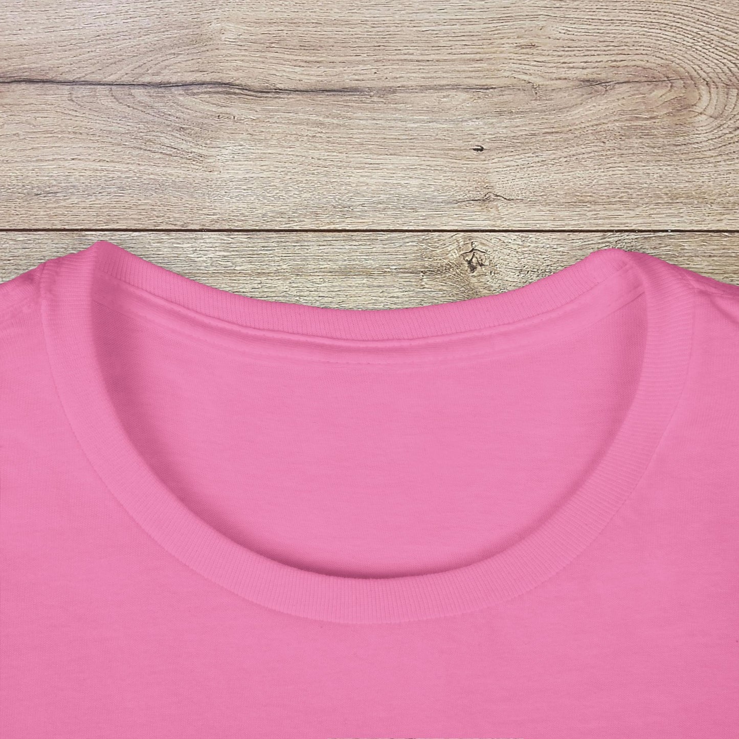 Close-up of the neckline of the pink Golf Wives Social Club Tee, featuring the soft texture and high-quality, ethically produced materials.