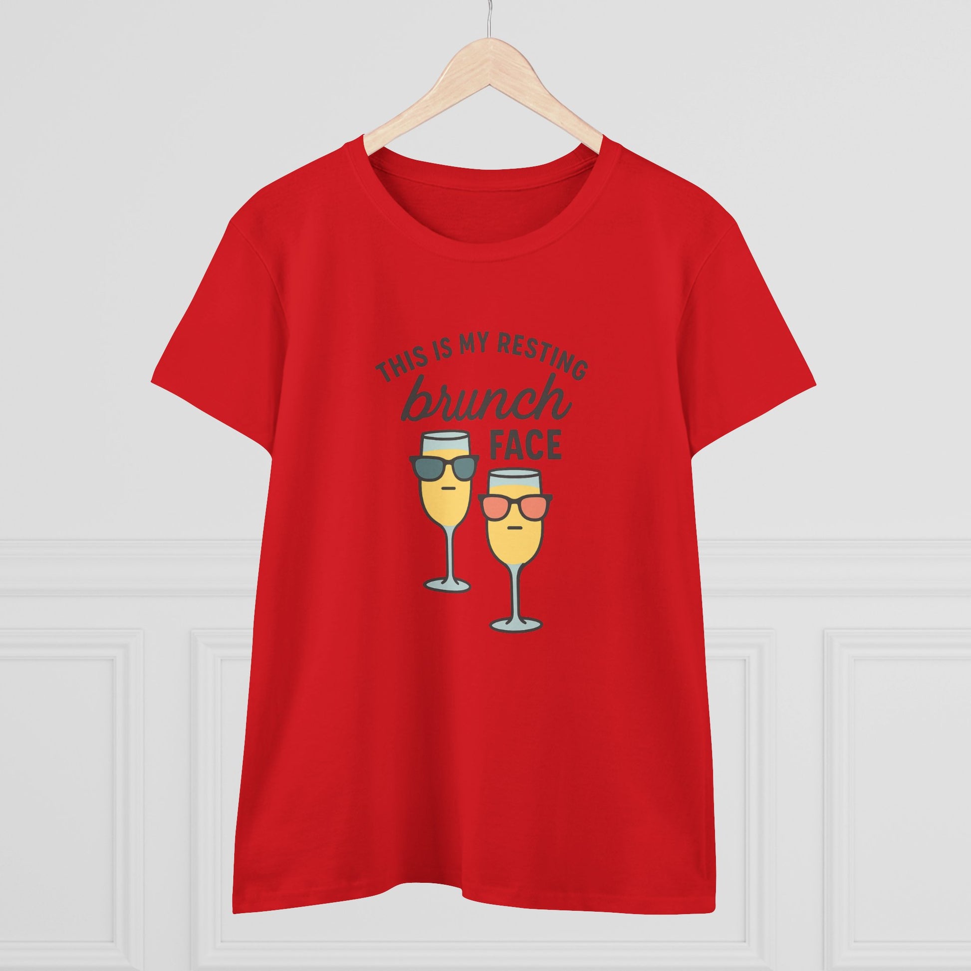 Women's Premium 100% Cotton Brunch Face Tee in red featuring a playful design with two glasses of mimosa and the phrase 'THIS IS MY RESTING brunch FACE'. Comfortable, durable, and stylish for casual brunch outings.