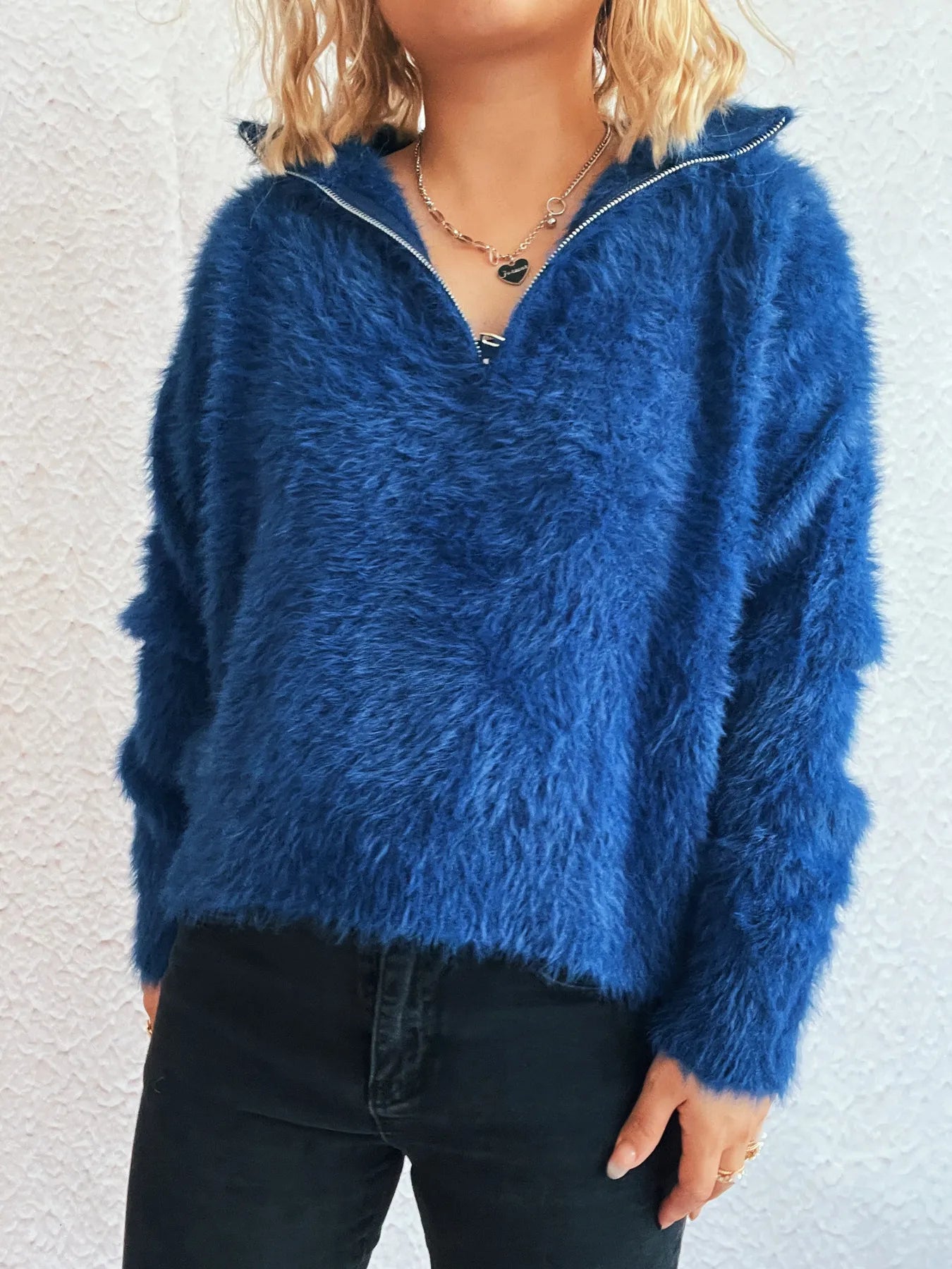 Close-up of the blue Cozy Fuzzy Half-Zip Sweater for Women, focusing on the half-zip collar and cozy fuzzy texture.