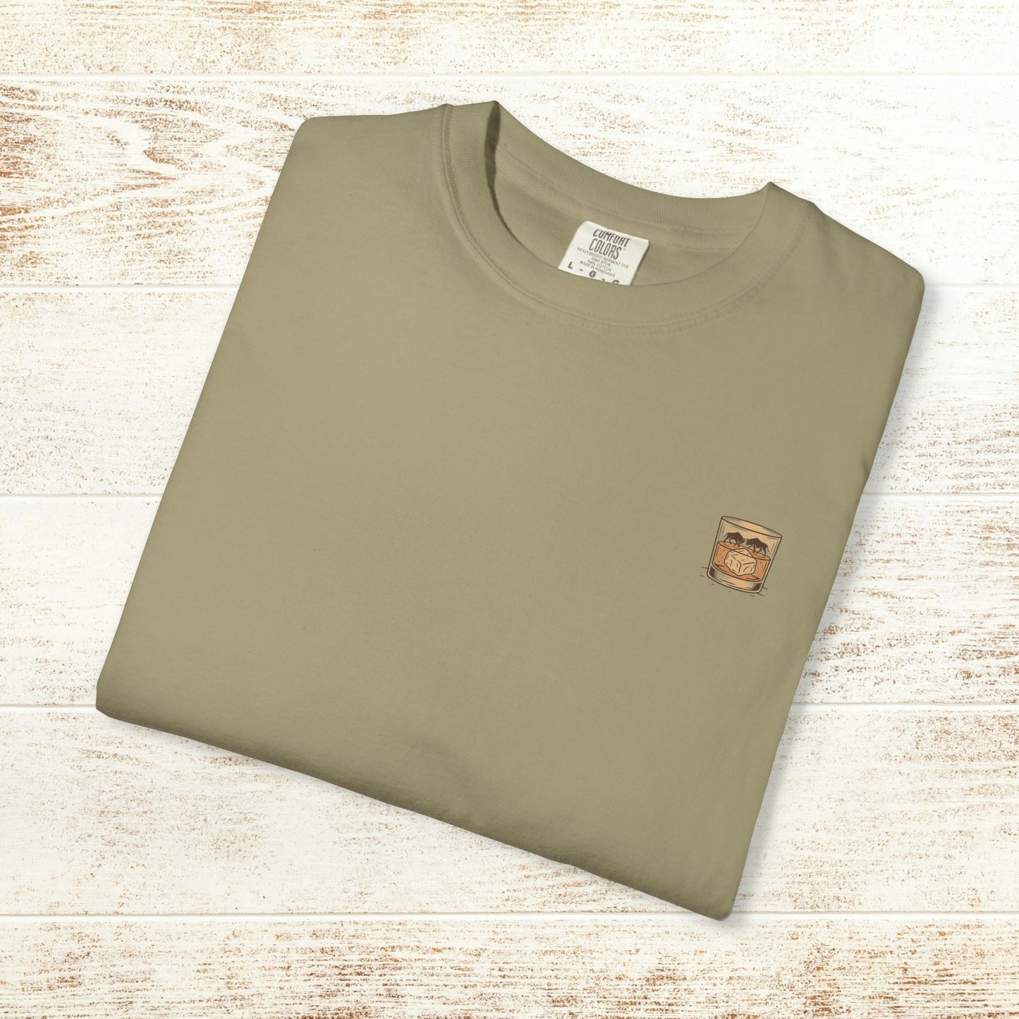 Rodeo On The Rocks Tee displayed flat, showcasing the unique garment-dyed style and soft 100% US cotton fabric, perfect for casual wear.