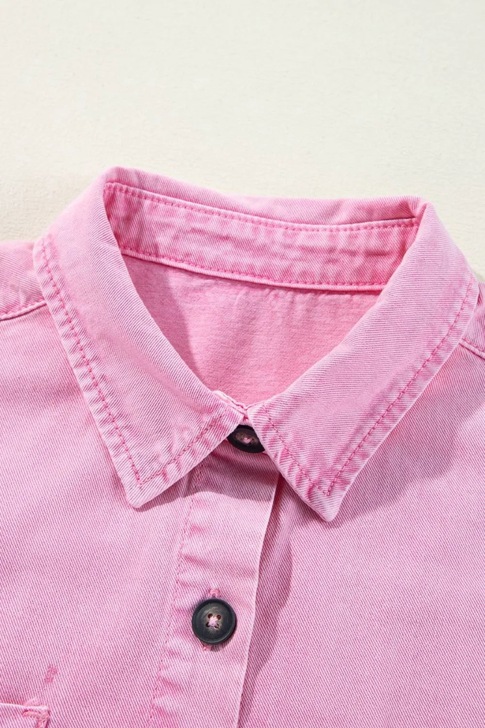 Close-up of the collar and button area of a Button Down Short Sleeve Denim Dress with Pockets, highlighting the quality stitching and design.
