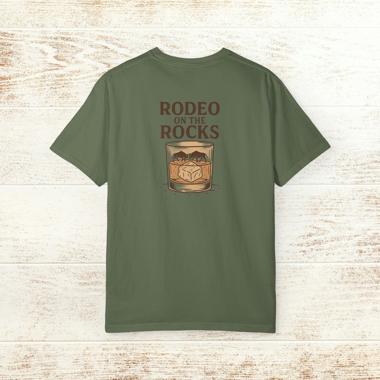 Back view of the Rodeo On The Rocks Tee, highlighting the bold graphic design with text 'RODEO ON THE ROCKS' and glass illustration.