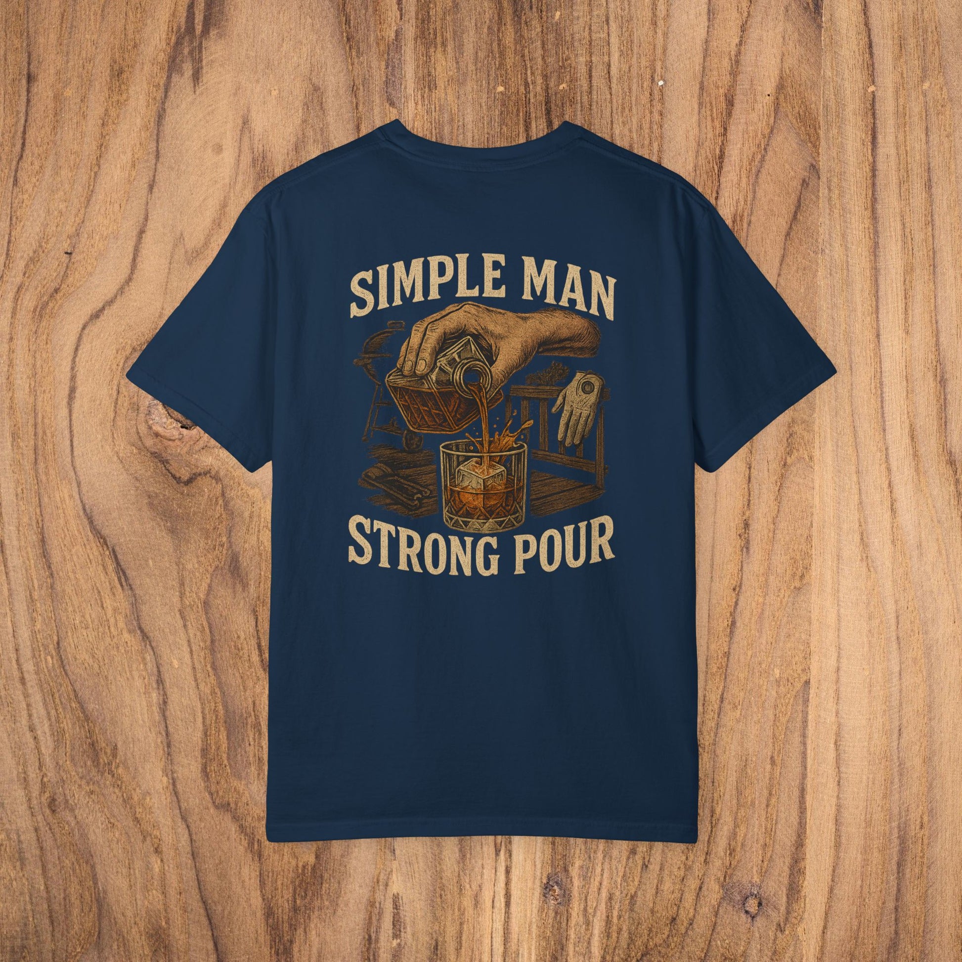 Back view of the Simple Man Strong Pour T-Shirt in navy blue, featuring an artistic design of a hand pouring a drink, perfect for casual outings.