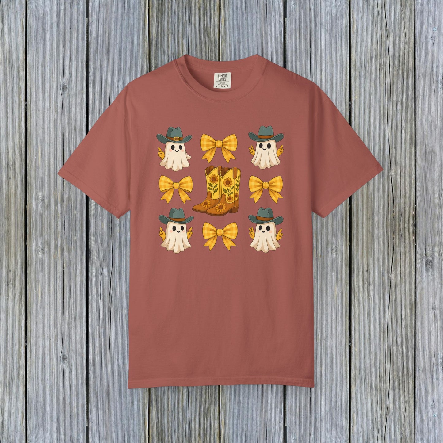 Cute Halloween T-Shirt decorated with adorable ghosts in cowboy hats and charming cowboy boots with yellow bows, designed for unisex fall fashion using eco-friendly materials.