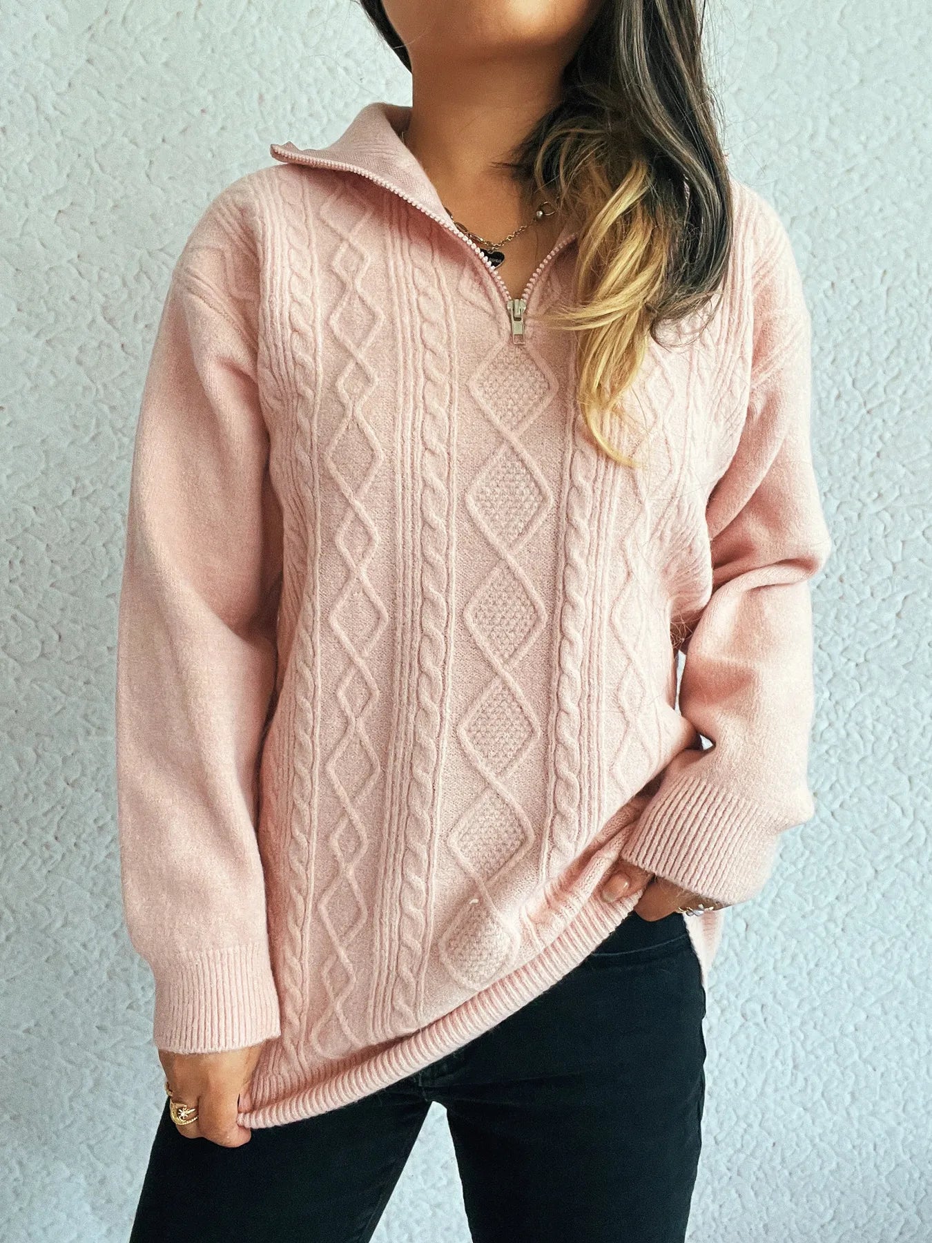 Stylish Cozy Cable-Knit Texture Zip Collar Long Sleeve Sweater in soft pink, highlighting a stylish zip collar and slightly oversized design for versatility.