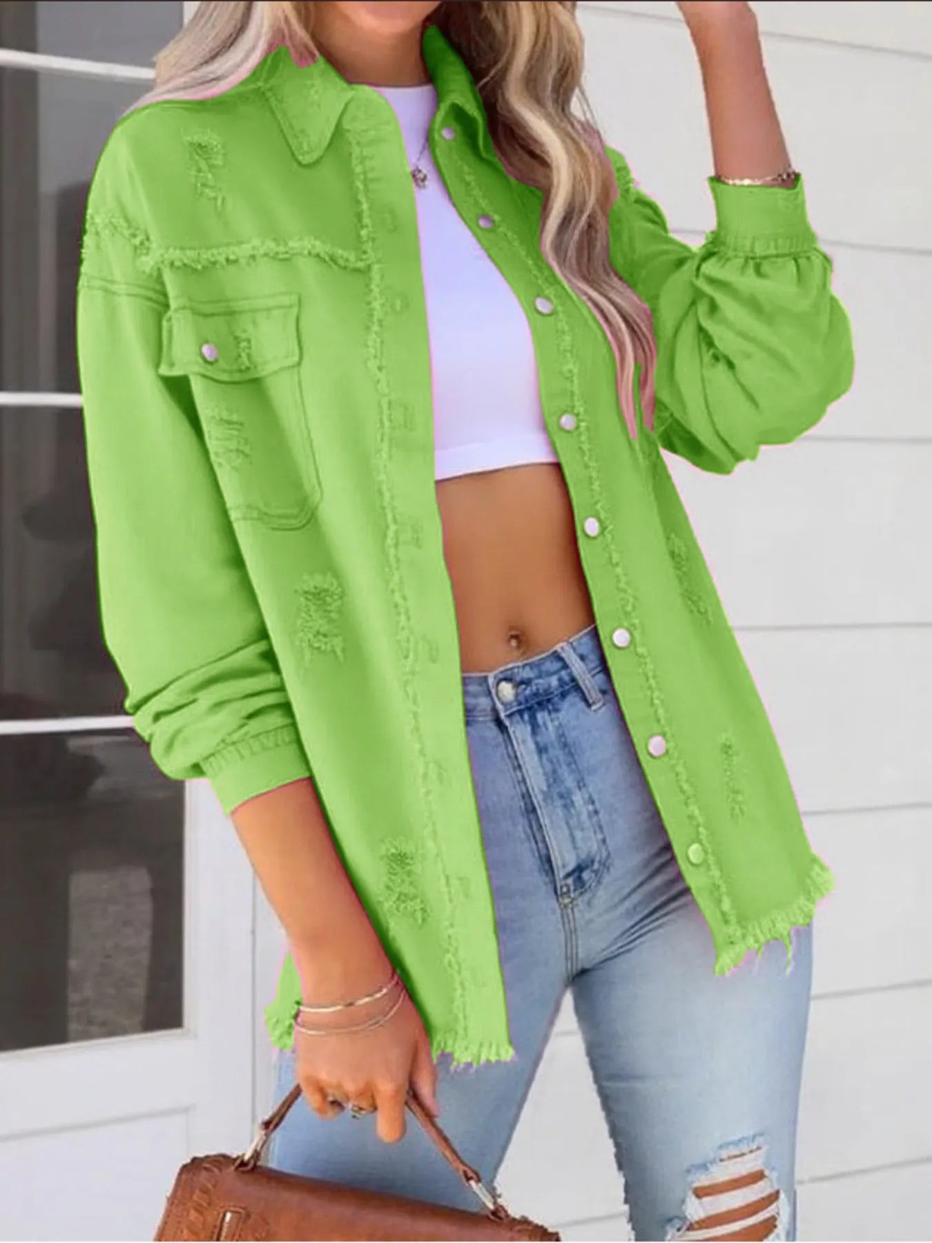 Model showcasing an Oversized Distressed Denim Jacket with Frayed Edges and Buttoned Pockets - Trendy Casual Outerwear in bright green, paired with high-waisted jeans.