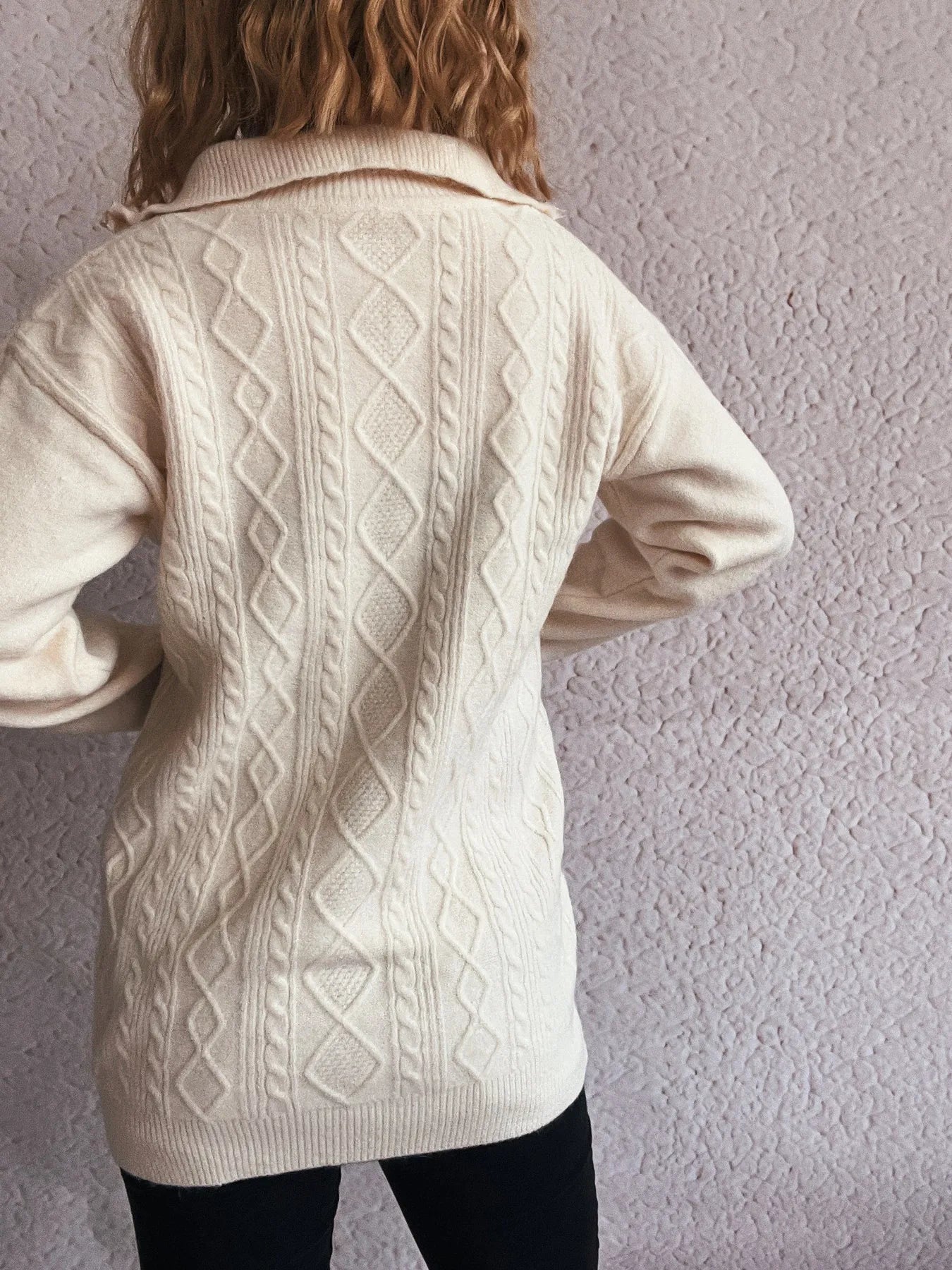 Back view of the Cozy Cable-Knit Texture Zip Collar Long Sleeve Sweater in cream, highlighting its textured design.