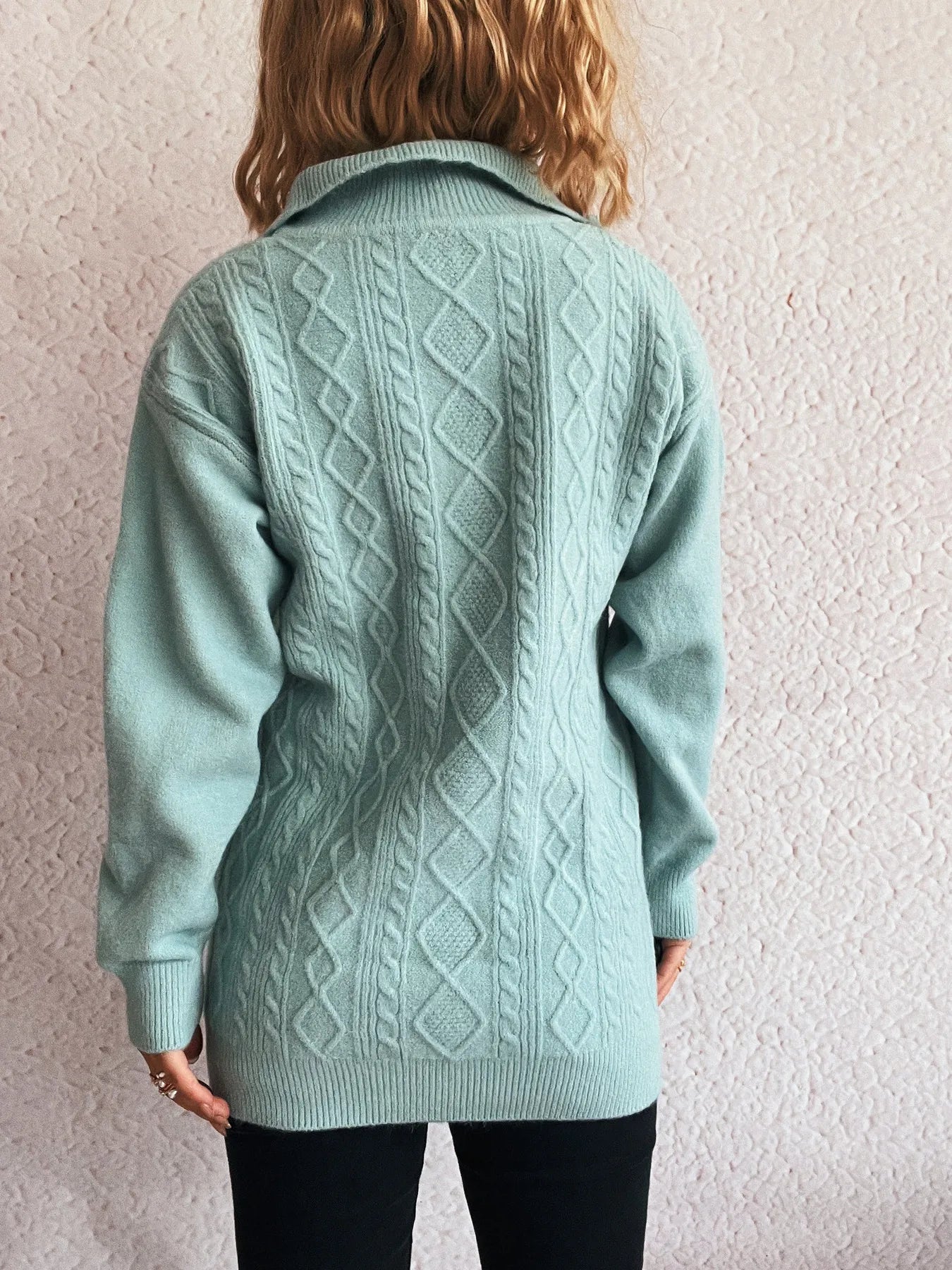 Back view of the Cozy Cable-Knit Texture Zip Collar Long Sleeve Sweater, emphasizing its length and detailed knit design.