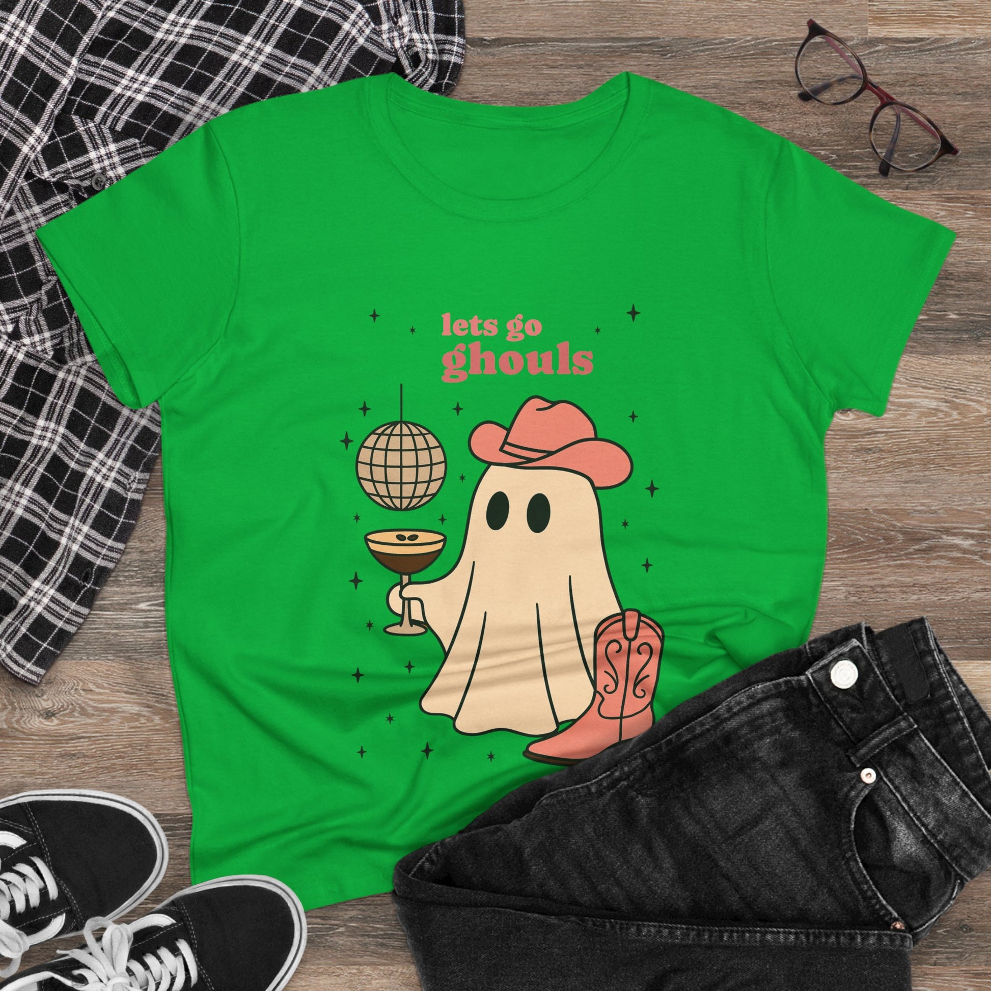 Let's Go Ghouls Tee in green featuring a lively ghost with a drink and hat, a fun addition to your Halloween wardrobe.