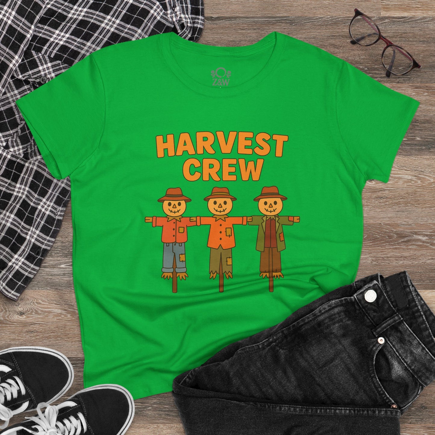 Stylish green Harvest Crew Halloween T-Shirt with playful scarecrow graphics, crafted from eco-friendly 100% ring-spun cotton for comfort and style.