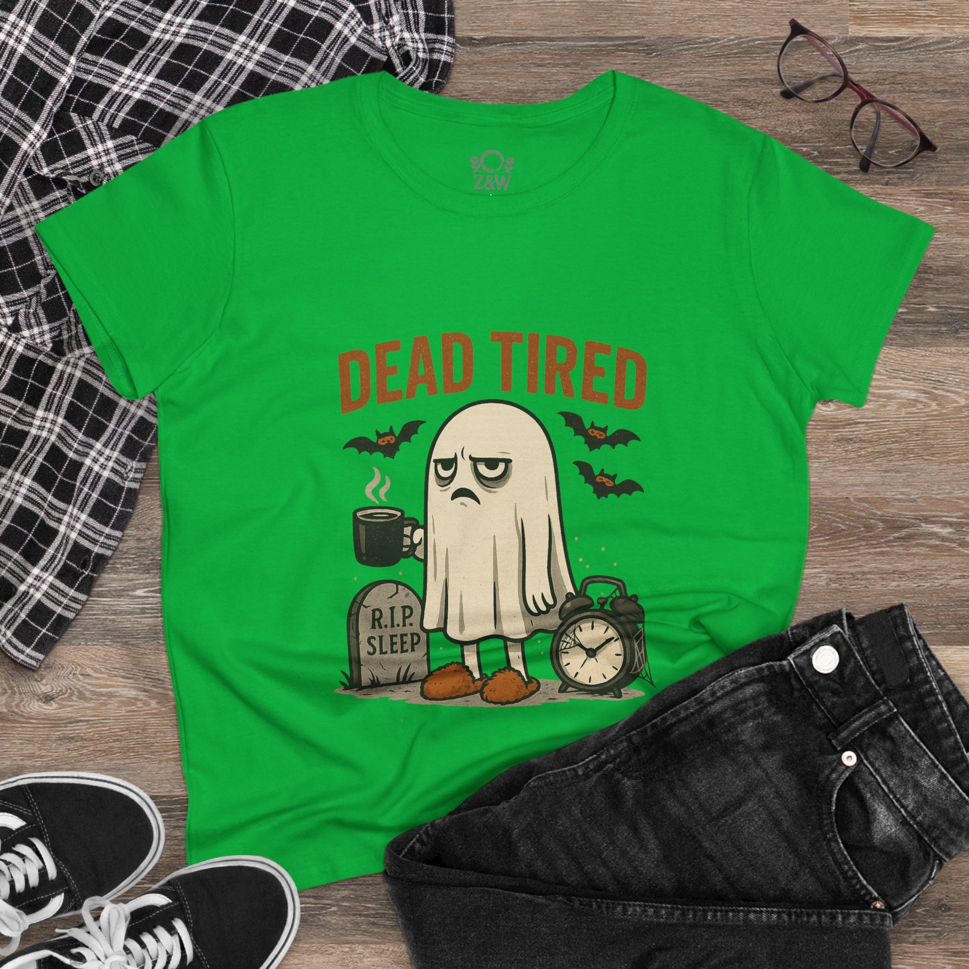Stylish Cute Whimsical Ghost T-Shirt for Halloween, showcasing a sleepy ghost with coffee and alarm clock graphics, on a lively green shirt, ideal for comfy wear.