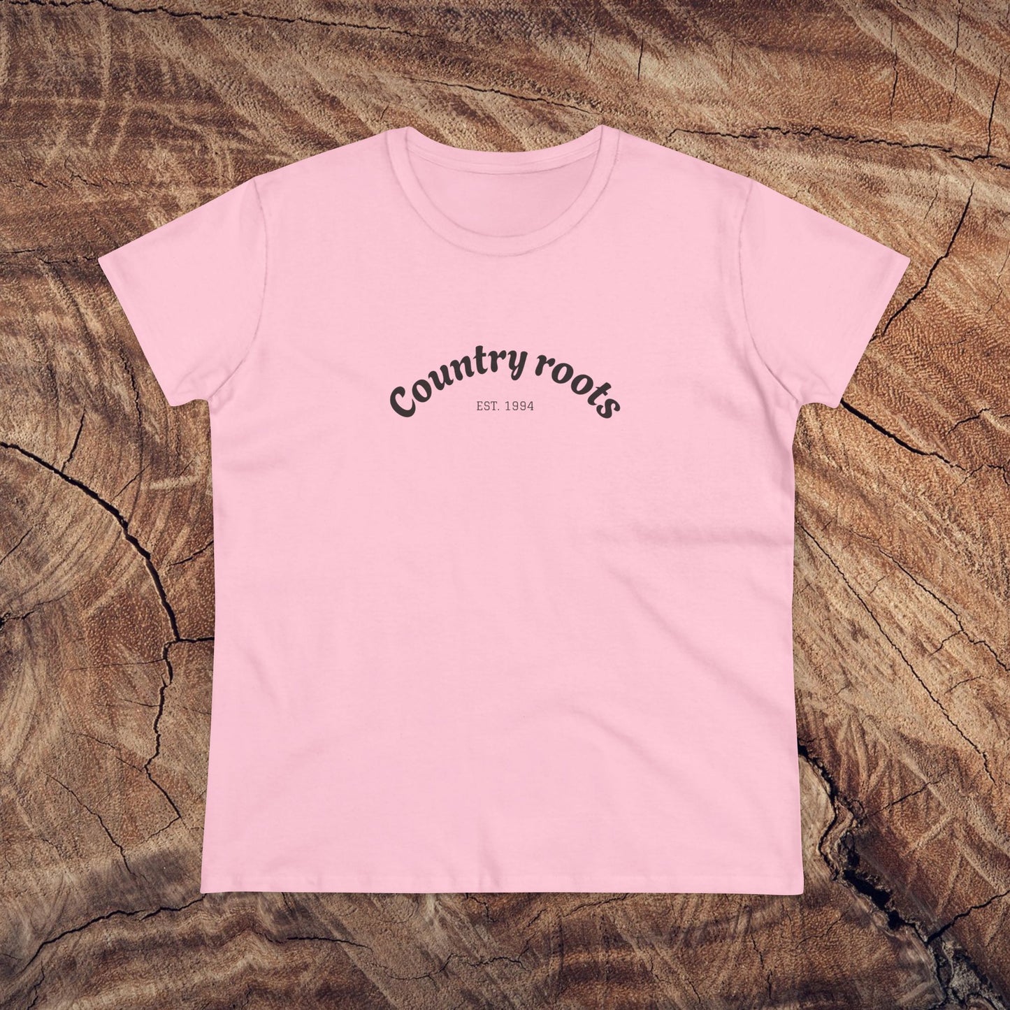 Country Roots Cowgirl Tee in cheerful pink, embodying the spirit of cowgirl fashion with the 'Country roots' logo, great for everyday wear.