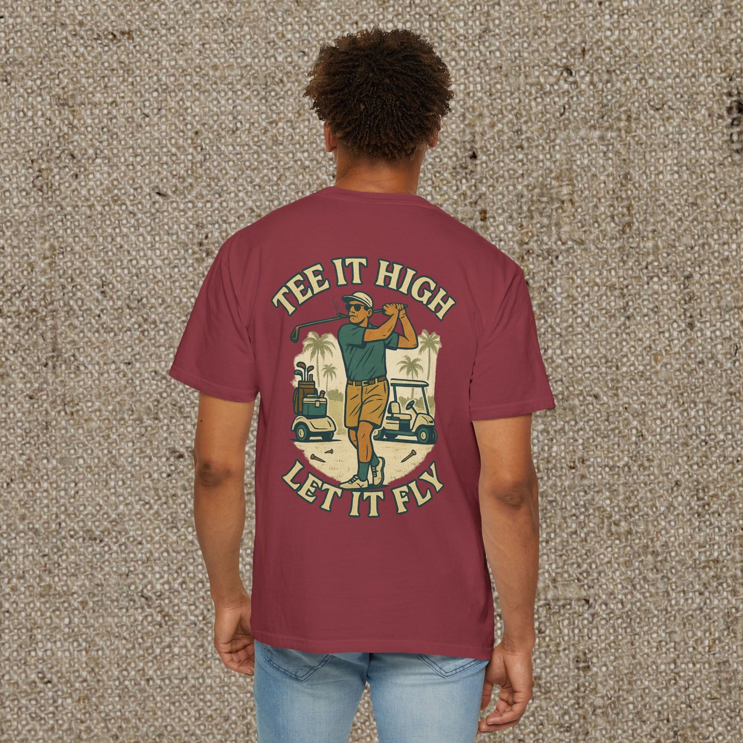 Back view of the Tee It High Let It Fly Graphic Tee showcasing a vibrant graphic of a golfer in action, ideal for golf enthusiasts looking for stylish attire.