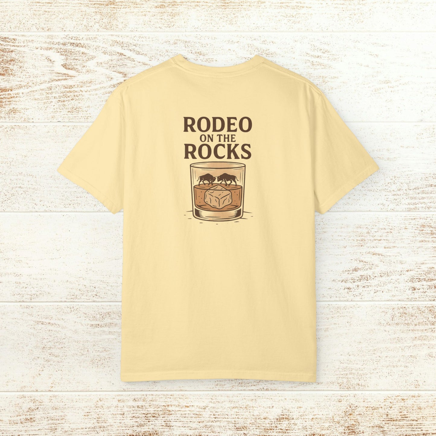 Rodeo On The Rocks Tee featuring a unique design of a glass with ice, displayed on a light background, perfect for casual wear.
