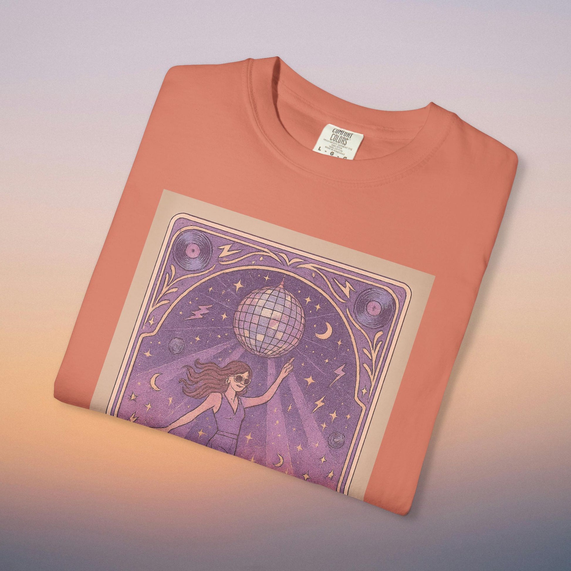 Groove Tarot Graphic Tee in coral hue, crafted from 100% ring-spun cotton, displaying a captivating graphic design with a disco ball and whimsical imagery, great for adding flair to your wardrobe.