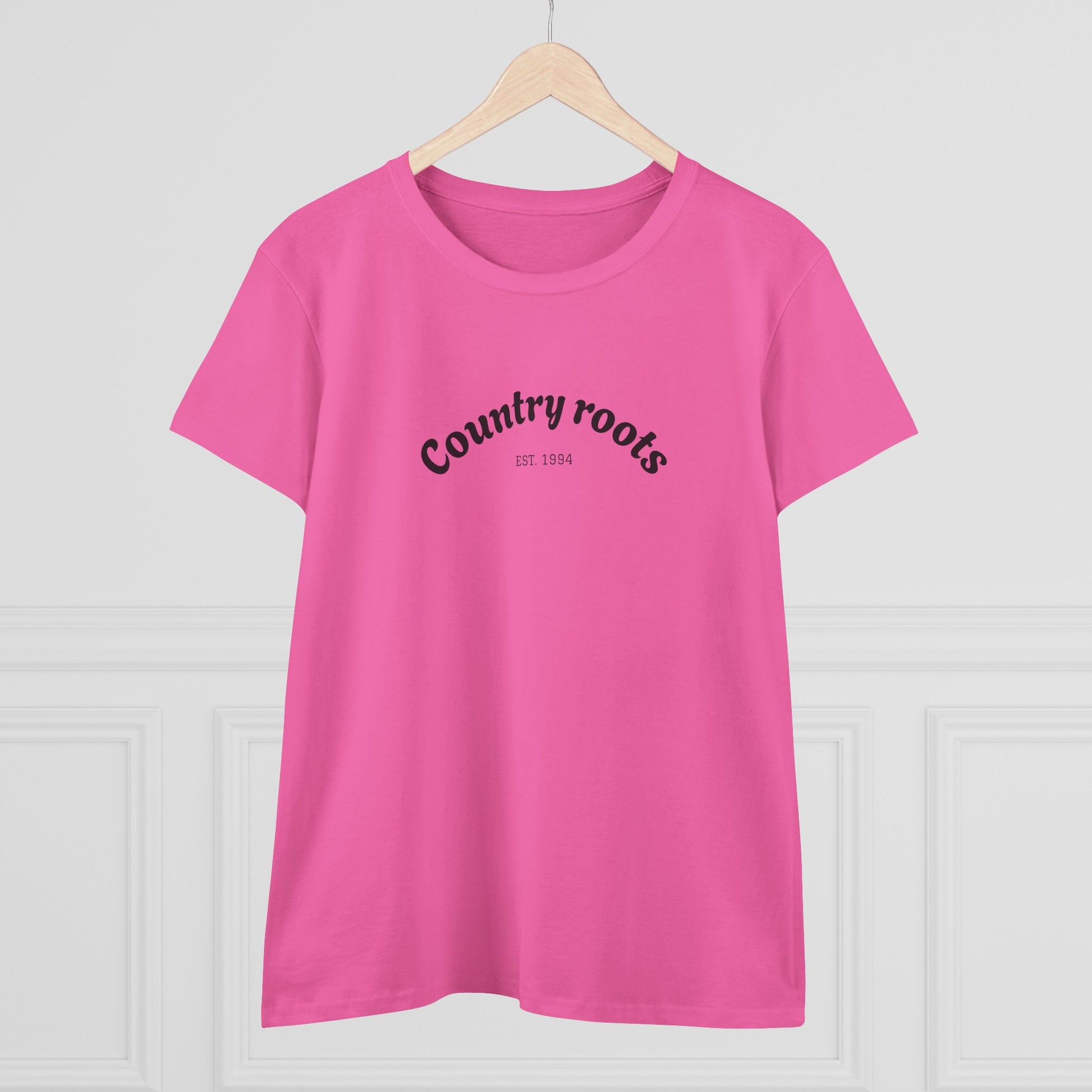 Front view of the Country Roots Cowgirl Tee in pink featuring a classic text design 'Country roots EST. 1994', ideal for stylish everyday wear.