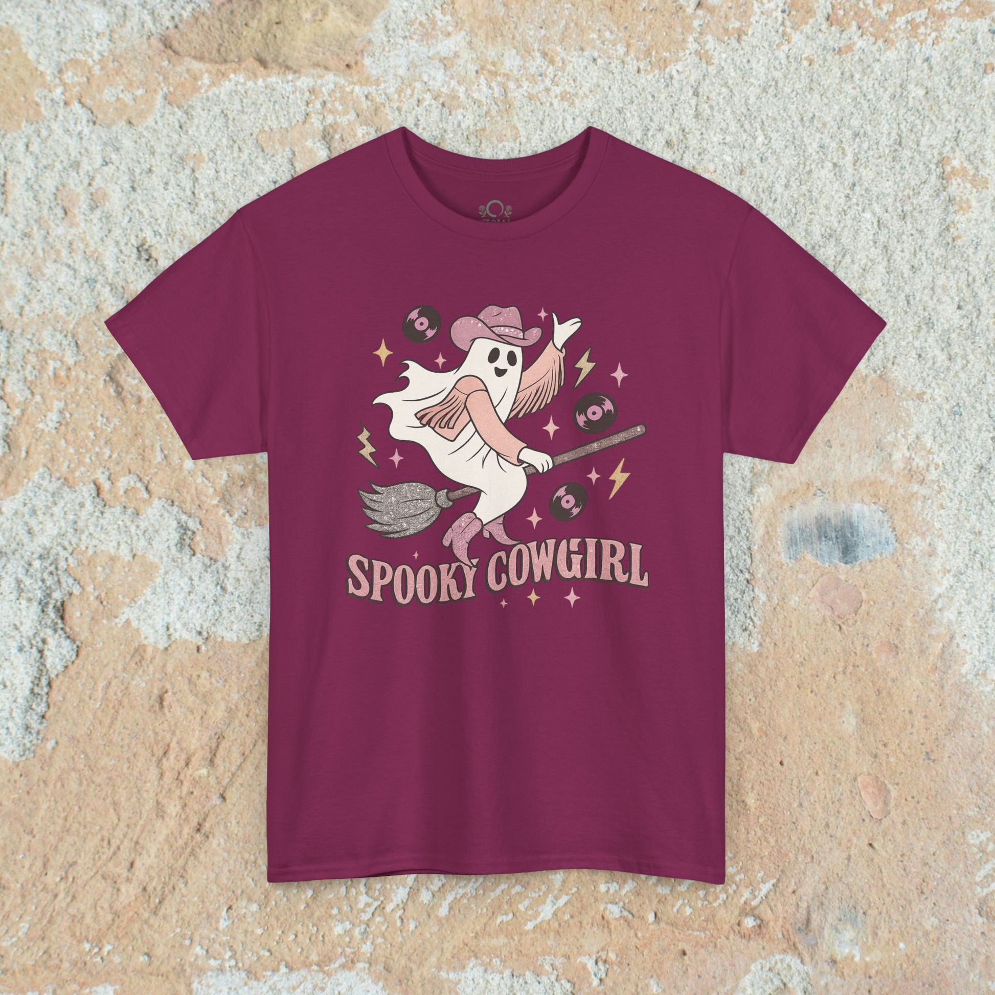 Spooky Cowgirl Graphic Tee in burgundy color, depicting a whimsical ghost with a cowboy hat, great for casual outings and Halloween celebrations.