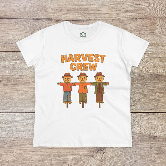 Harvest Crew Halloween T-Shirt featuring a playful design of three scarecrows standing together, perfect for festive celebrations. Made of soft 100% ring-spun cotton.