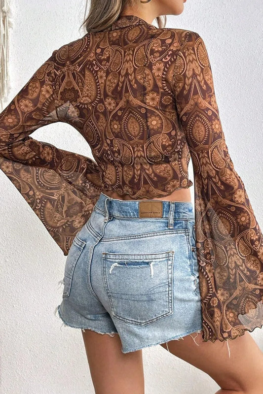 Sheer Printed Mock Neck Top with Flare Sleeves - Slightly Stretchy Casual Style featuring a back view, styled with high-waisted denim shorts, perfect for casual outings or beach days.