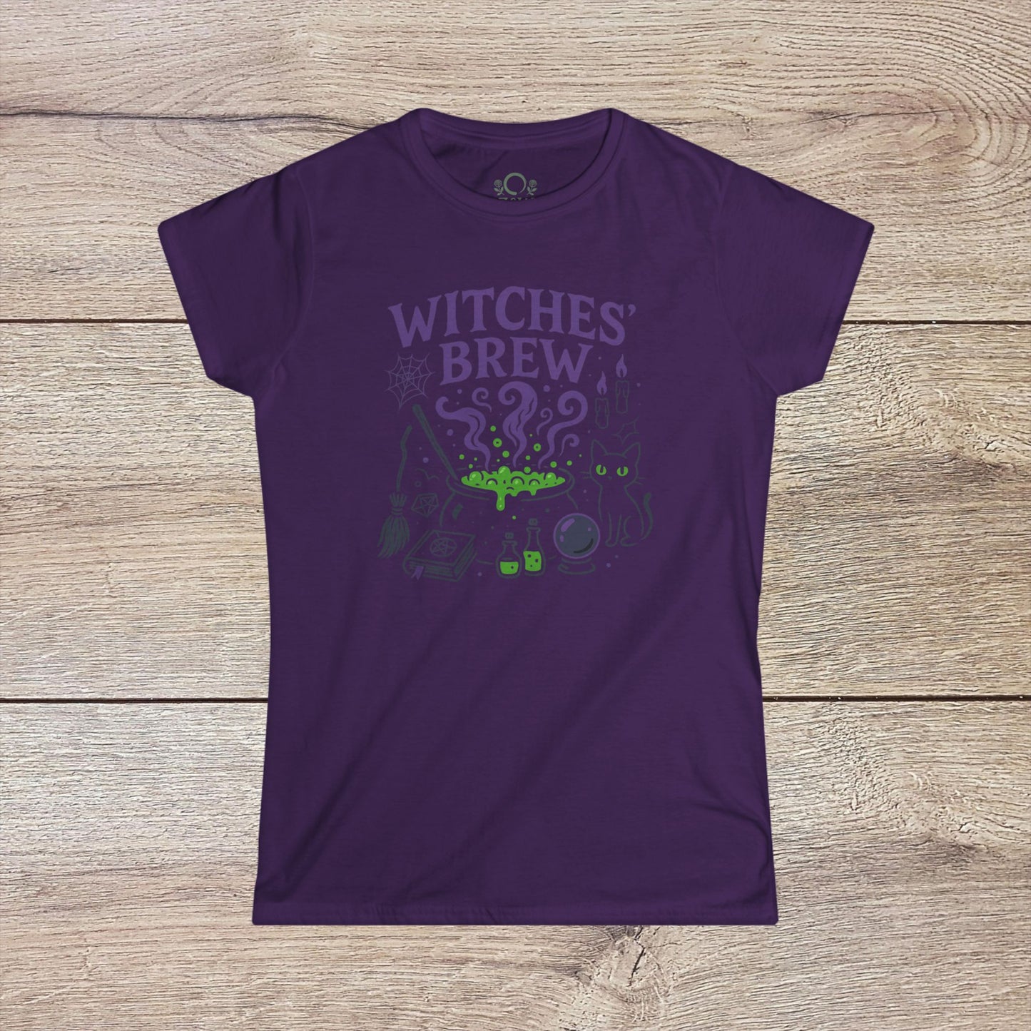 Witches' Brew Halloween T-Shirt in a rich purple color, displaying a whimsical print of witchcraft symbols and a cat, crafted from eco-friendly cotton for comfort.