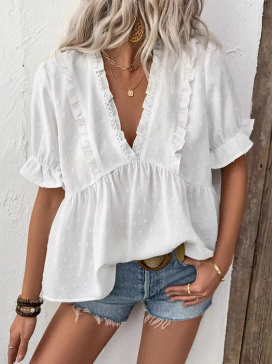 Trendy Swiss Dot Ruffled V-Neck Blouse with Flounce Sleeves, showcasing a frill design, perfect for a casual yet fashionable outfit with shorts.