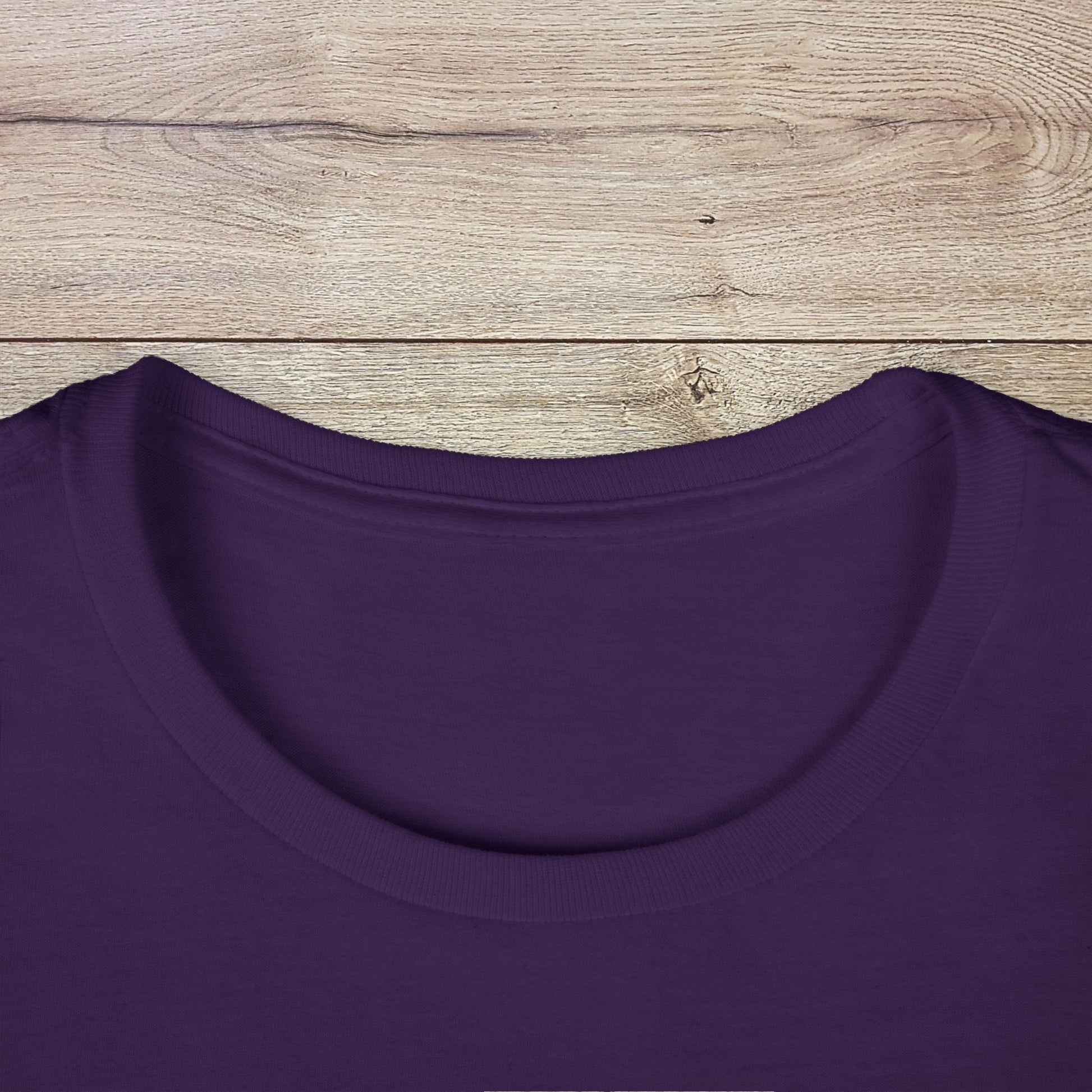 Detailed close-up of the neckline of the purple Golf Wives Social Club Tee, emphasizing the highly elastic ribbed collar and ethically made quality.