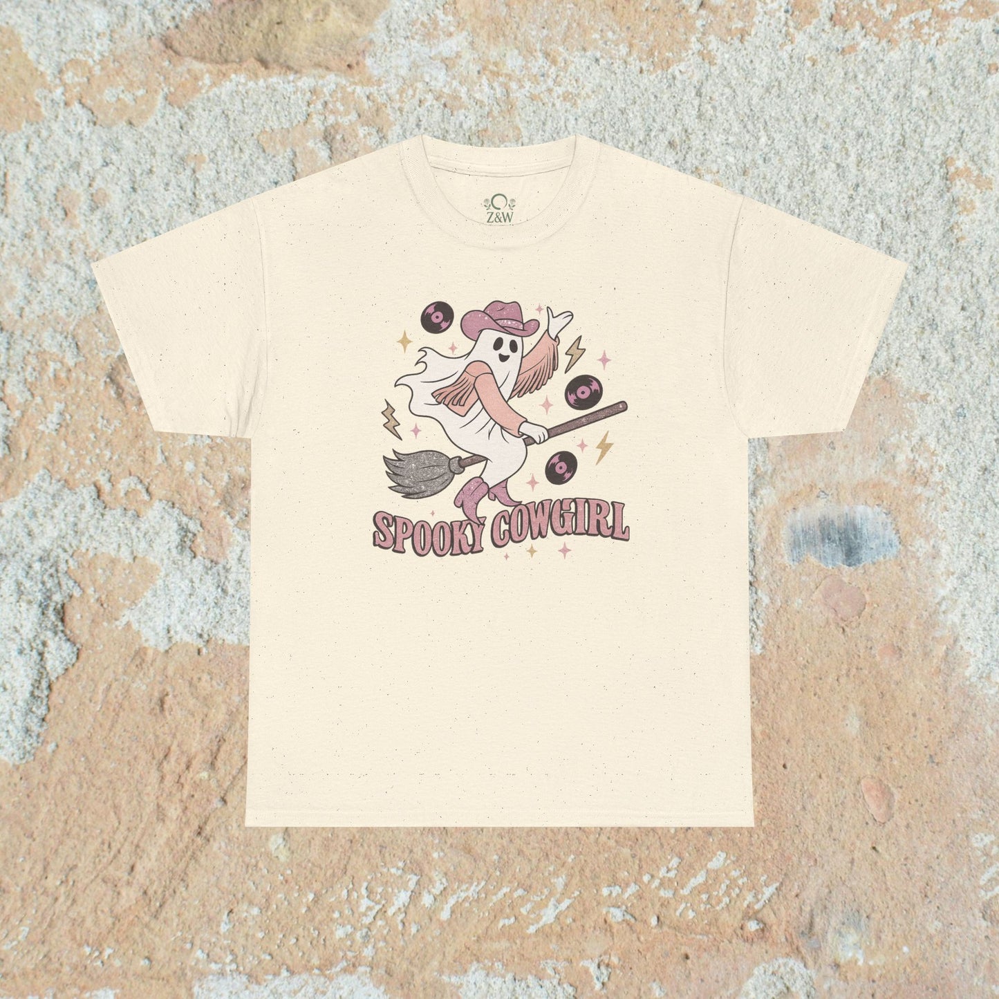 Off-white Spooky Cowgirl Graphic Tee displaying a playful ghost cowgirl with vinyl records, crafted from soft fabric for comfort.