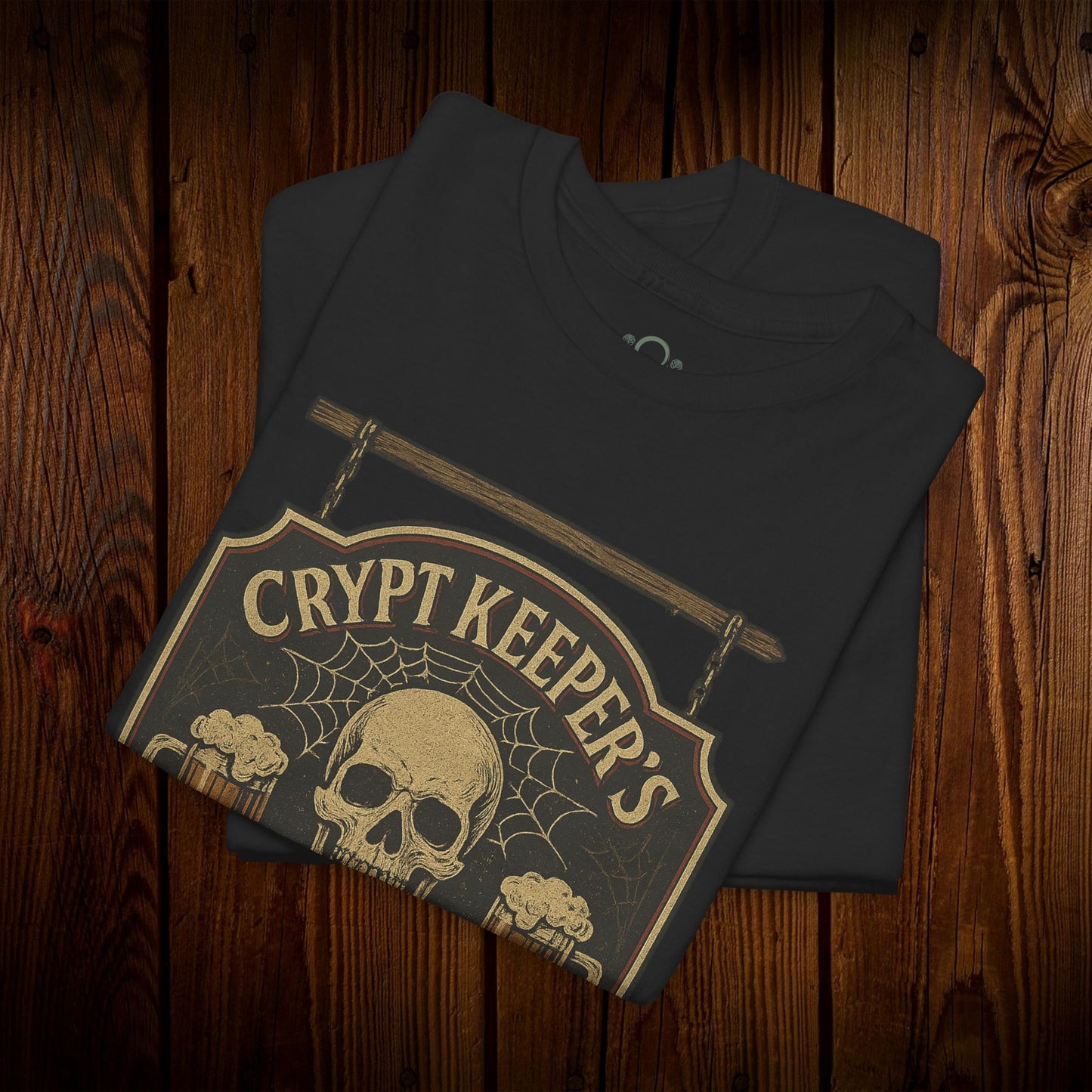 Close-up of Crypt Keeper's Pub Tee in black, highlighting the skull and spider web design, a great choice for Halloween and casual pub visits.
