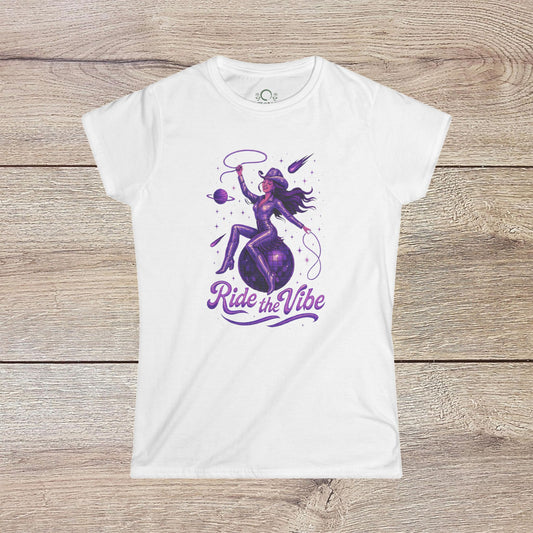 Vibrant Ride The Vibe Tee in white featuring a stylish graphic of a woman riding a planet, designed in durable 100% ring-spun cotton.