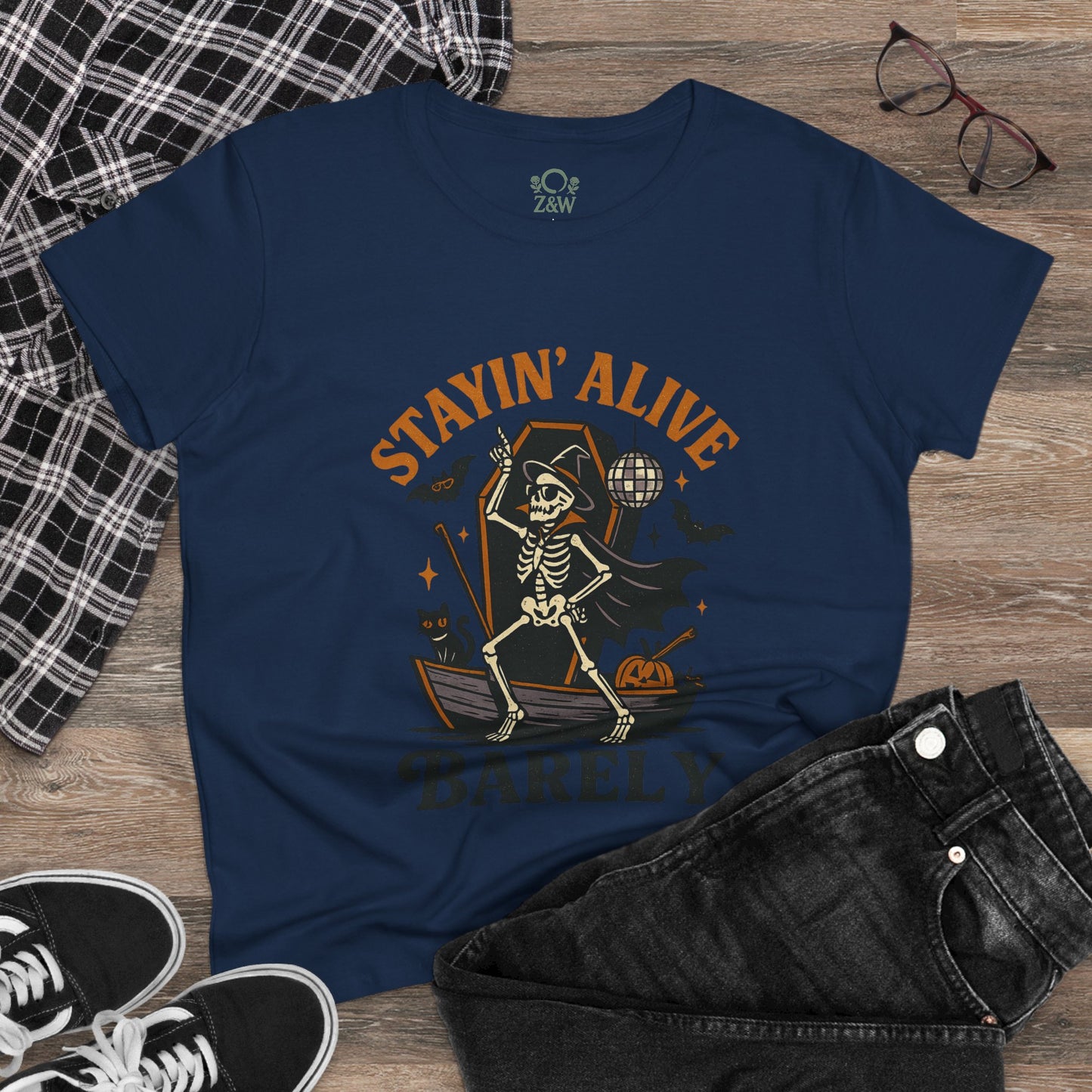 Stylish view of the Stayin’ Alive T-Shirt in navy with a skeleton design, perfect for casual outings and Halloween festivities.