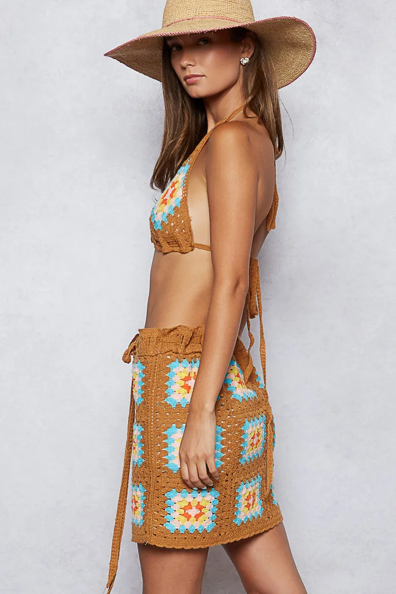 Side view of the Bohemian Crochet Halter Neck Cami & Skirt Sweater Set in Vibrant Orange & Turquoise, featuring a unique 100% polyester crochet pattern suitable for chic beach outings.