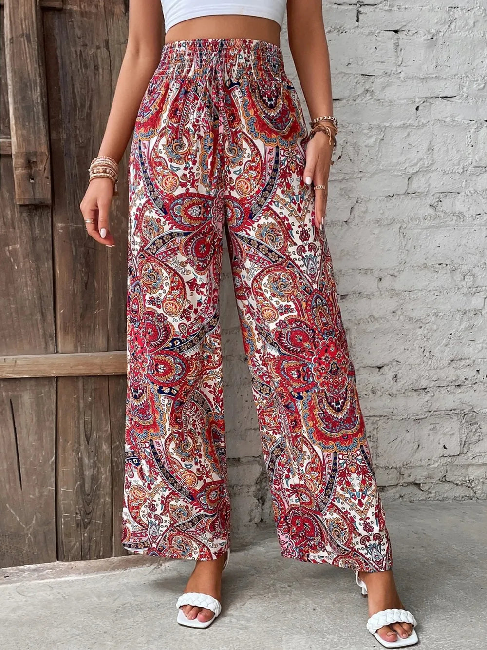 Trendy Printed Wide Leg Pants with Tied Detail in vibrant red and white paisley print, showcasing a comfortable fit, crafted from 100% opaque polyester, ideal for versatile styling.