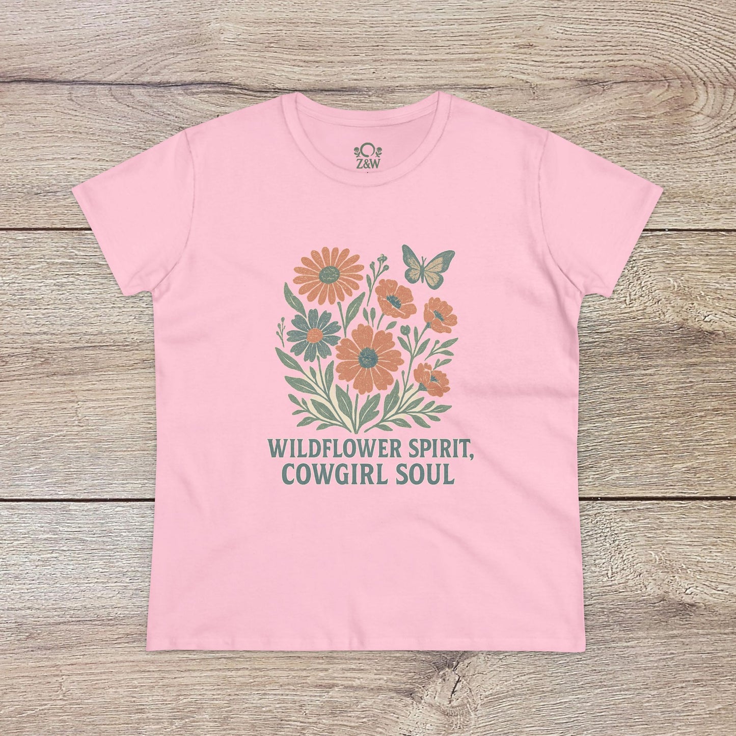 Wildflower Spirit Cotton Tee in soft pink, featuring a charming floral design and the words 'WILDFLOWER SPIRIT, COWGIRL SOUL' - a delightful choice for everyday elegance.