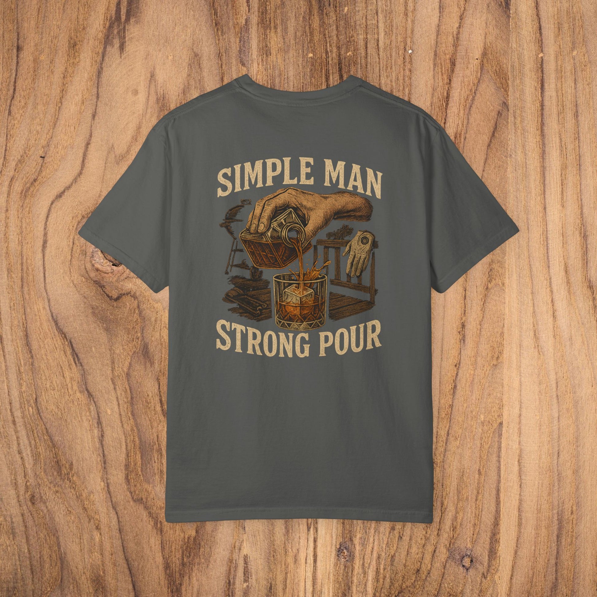Simple Man Strong Pour T-Shirt in charcoal featuring a creative design of a hand pouring a drink, made from 100% cotton for a classic fit and casual look.