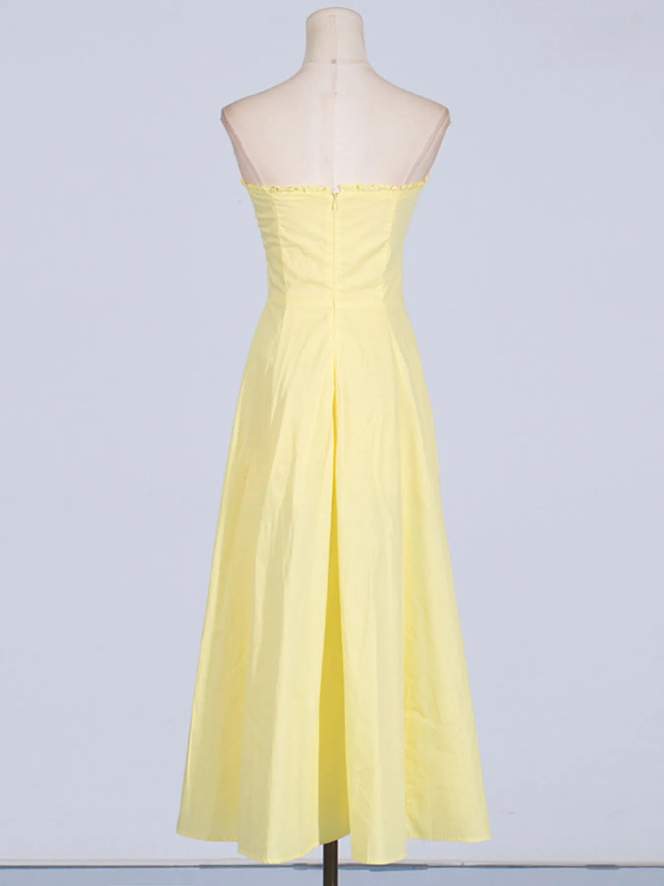 Back view of the Trendy Slit Sleeveless Midi Dress with Zip Back in yellow, featuring a sleek closure detail and elegant fit for a refined look.