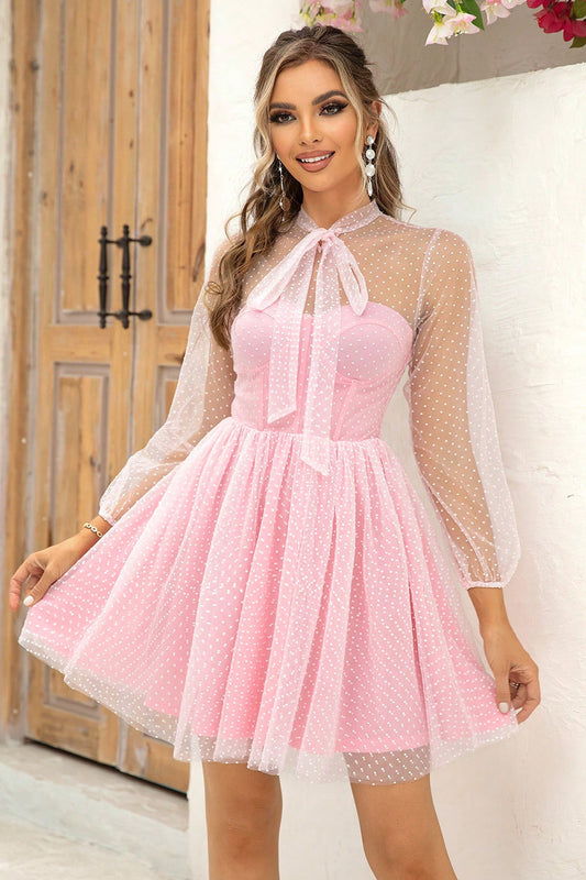 Chic Tie Neck Open Back Semi-Sheer Mesh Dress with Lining in pink with polka dots, featuring a tied neckline and sheer sleeves, perfect for stylish occasions.